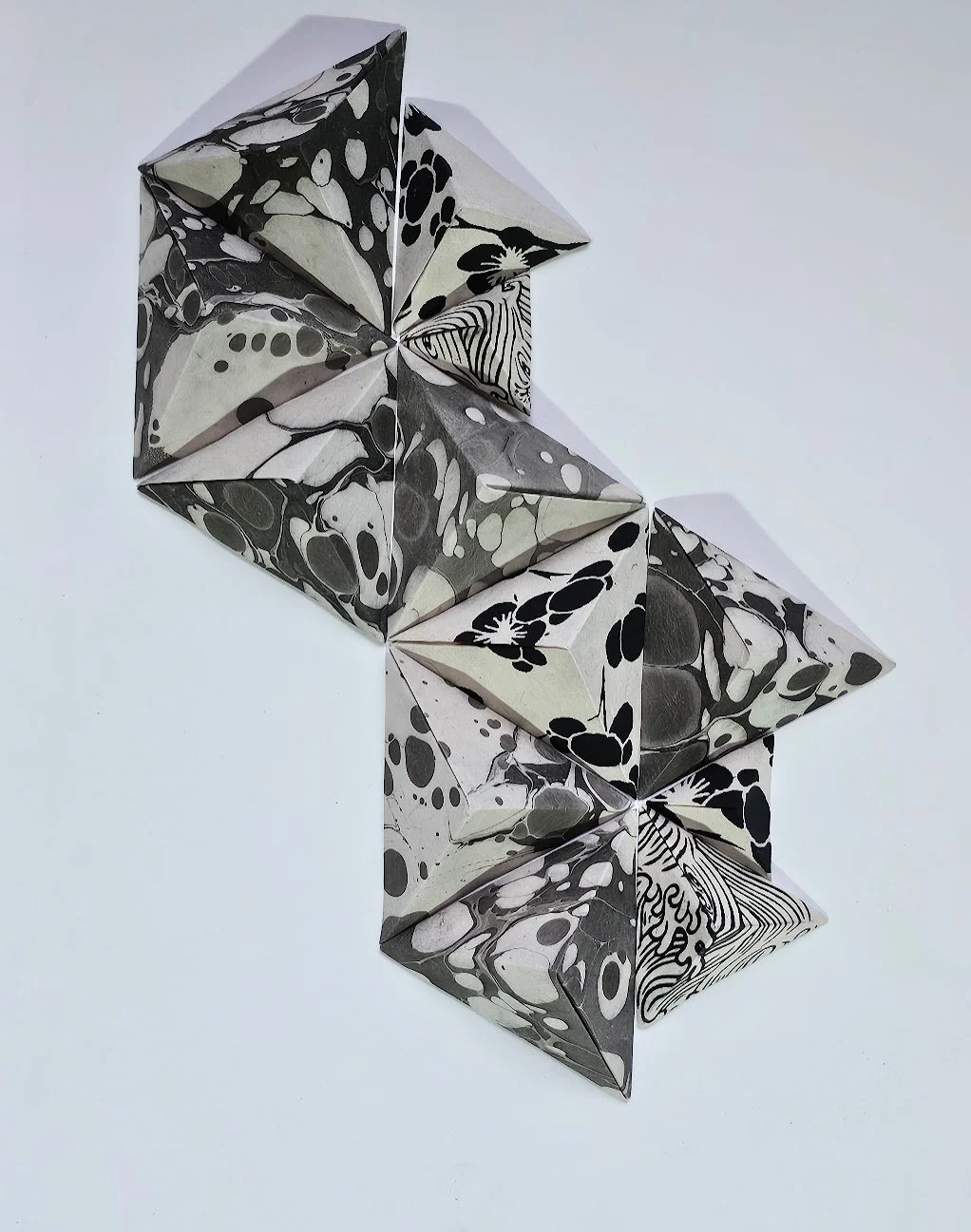 Higher Love I · 2024 · Hand-folded artisan paper on paper · 11 x 14 x 3 in ·Private Collection