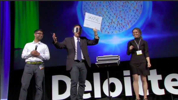 Corporate event audience actively engaged while Joshua Seth hosts as emcee, creating a fun and interactive atmosphere.