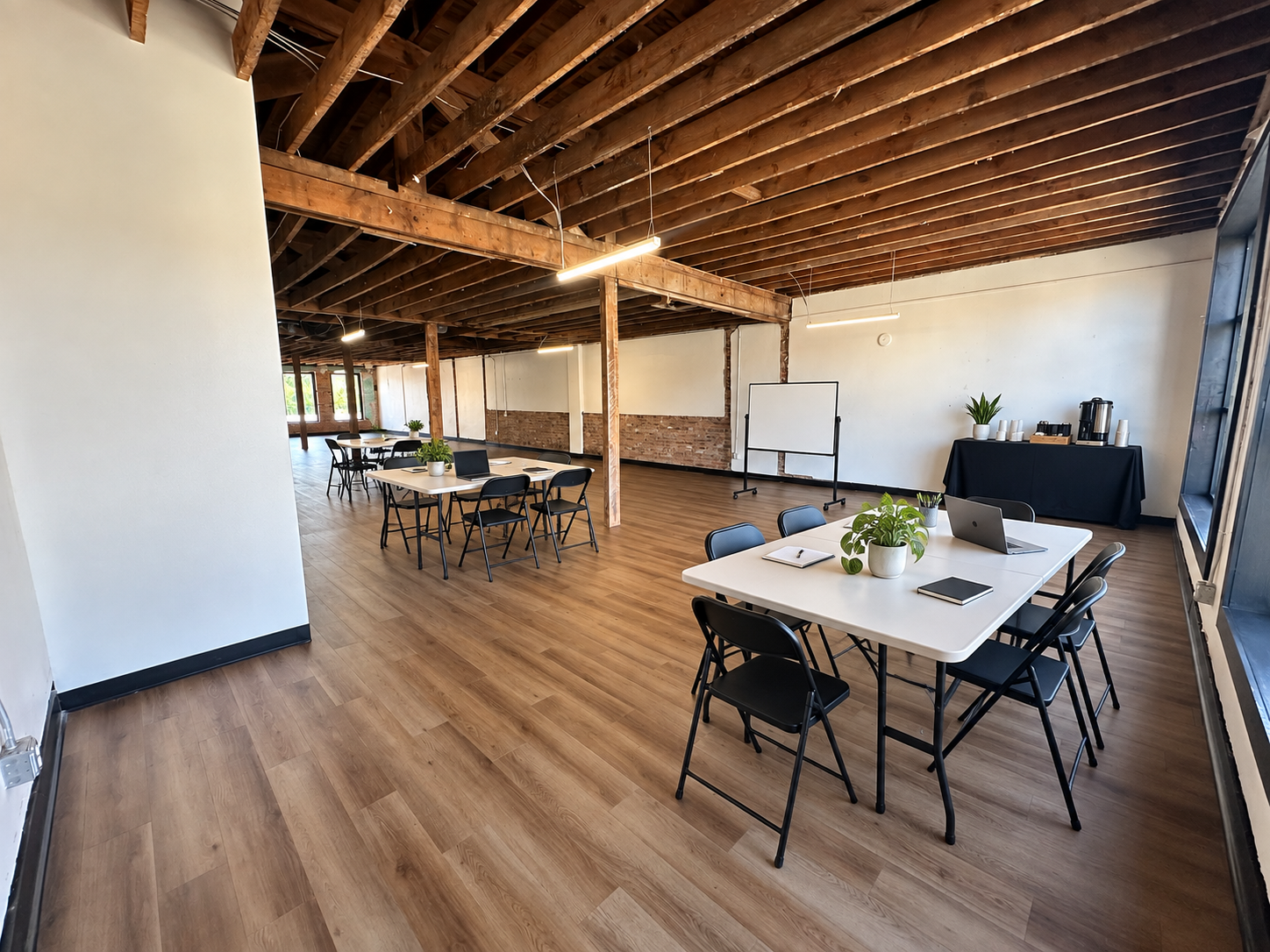 Coworking & small-business planning · Virtual staging
Rectangular tables make room for focused work, collaboration, and a monthly planning day. Bring laptops and presentation supplies, and ask about recurring weekday blocks without a full-time lease.