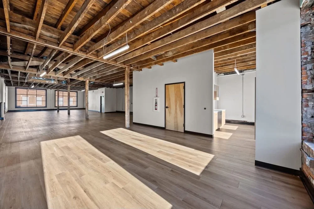 Open room viewed toward the front windows