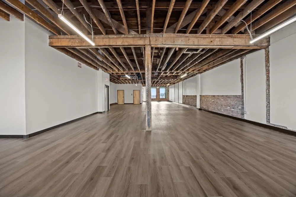 Full length of the room with historic timber beams