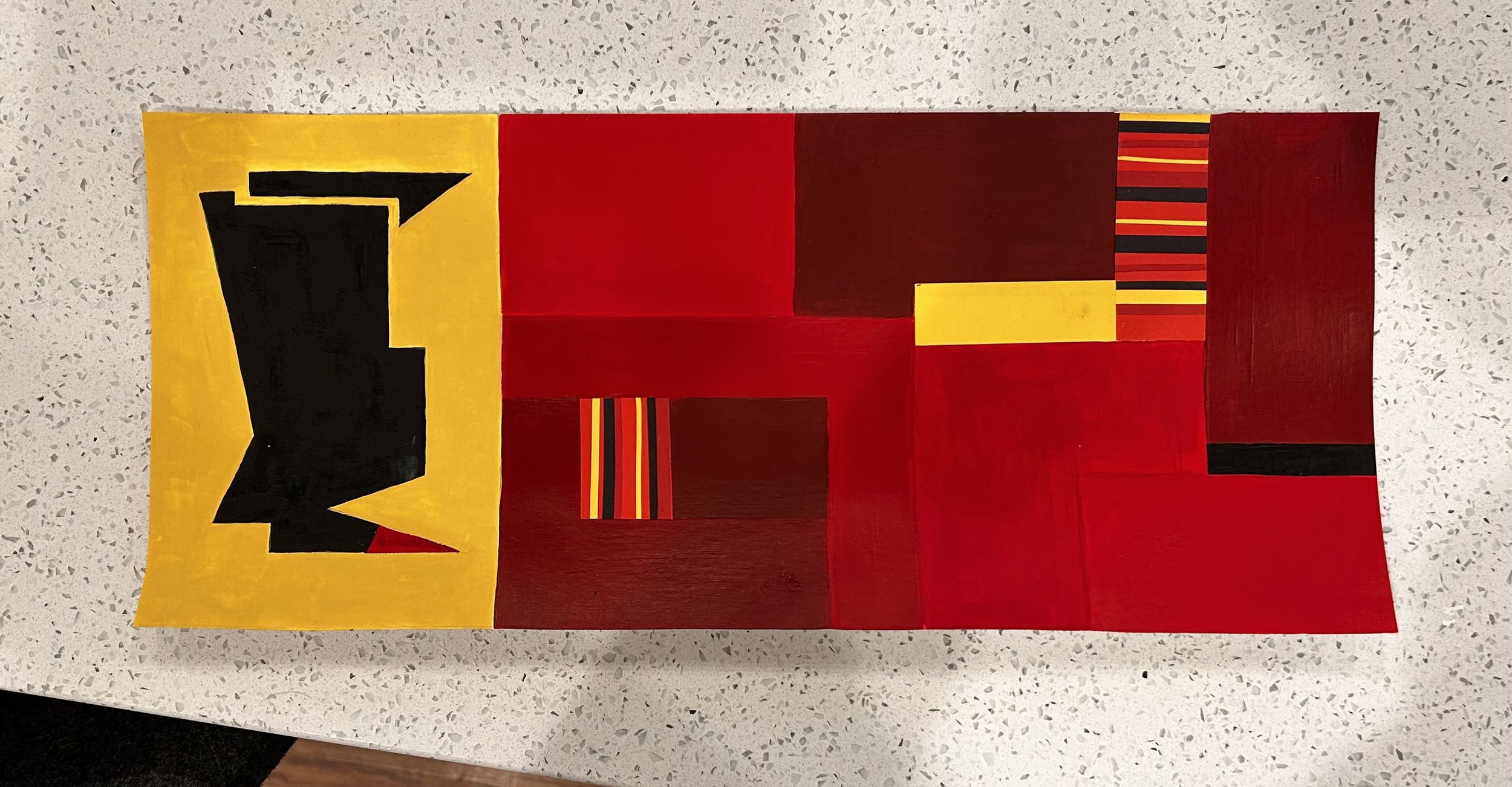 Abstract geometric painting with red, black, yellow, and striped patterns on a wall.