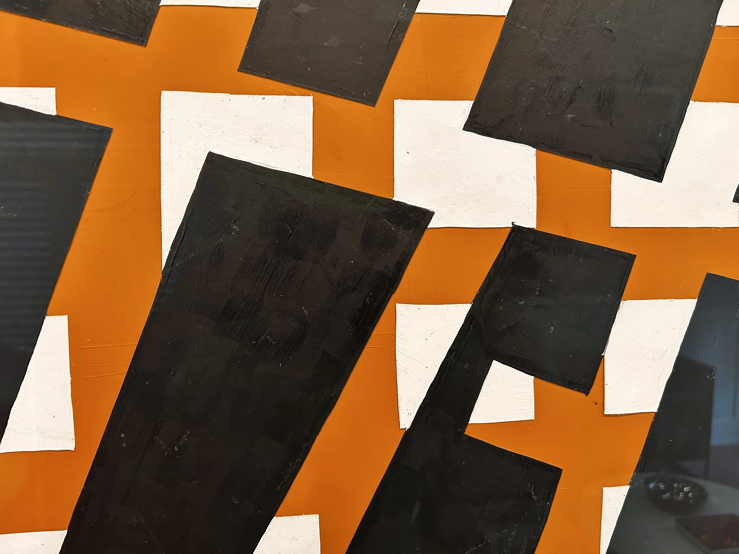 Abstract geometric artwork featuring overlapping black, white, and orange rectangular shapes with visible brush strokes on a bright orange background.