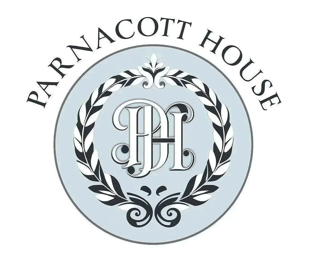 Logo for Parnacott House featuring a circular design with a black and white laurel wreath, the initials 'PH' in elaborate font, and the name 'PARNACOTT HOUSE' curved around the top of the circle.