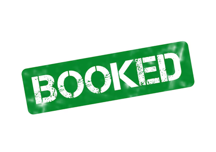 Green sign with white text that says 'BOOKED'