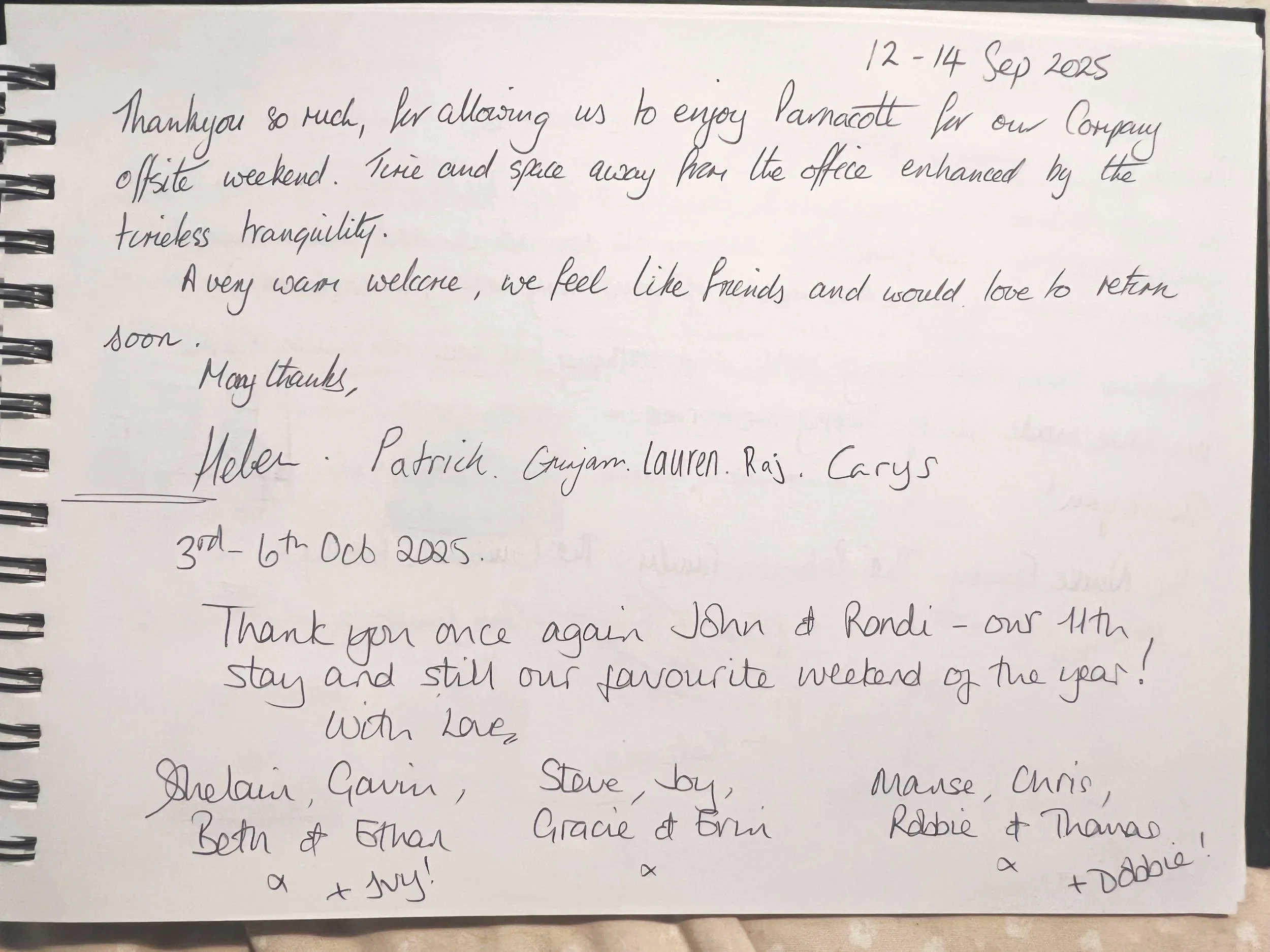 Handwritten gratitude message on a spiral notebook page, dated September 12-14, 2023, expressing thanks for a weekend of relaxation and friendship, signed by multiple people at Parnacott house.