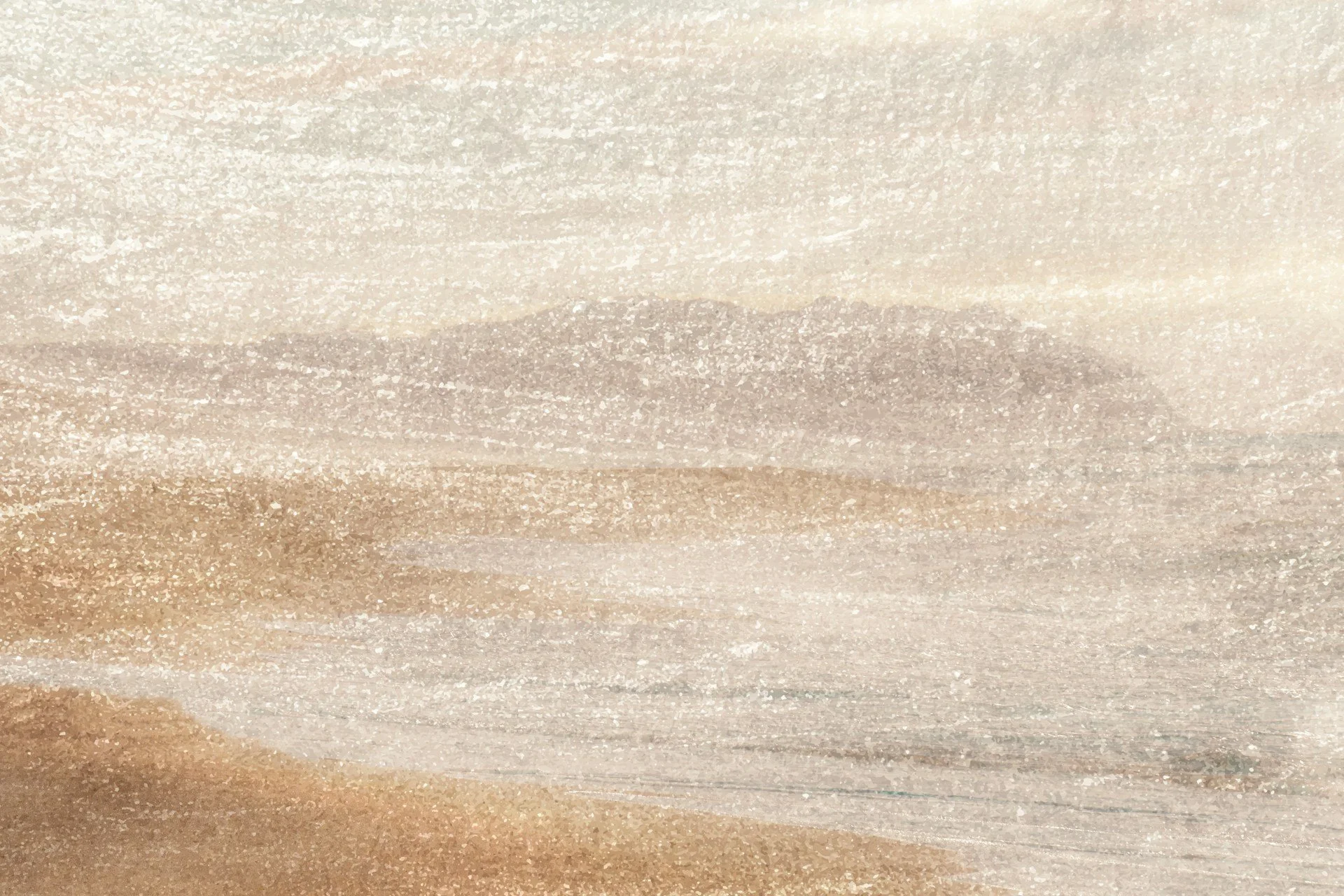 Close-up view of textured, layered, brownish-beige colored sand or soil surface with various subtle color variations and patterns.