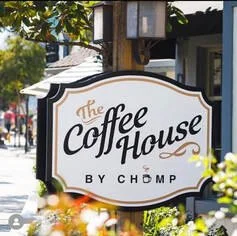The Coffee House by Chomp sign outside a café