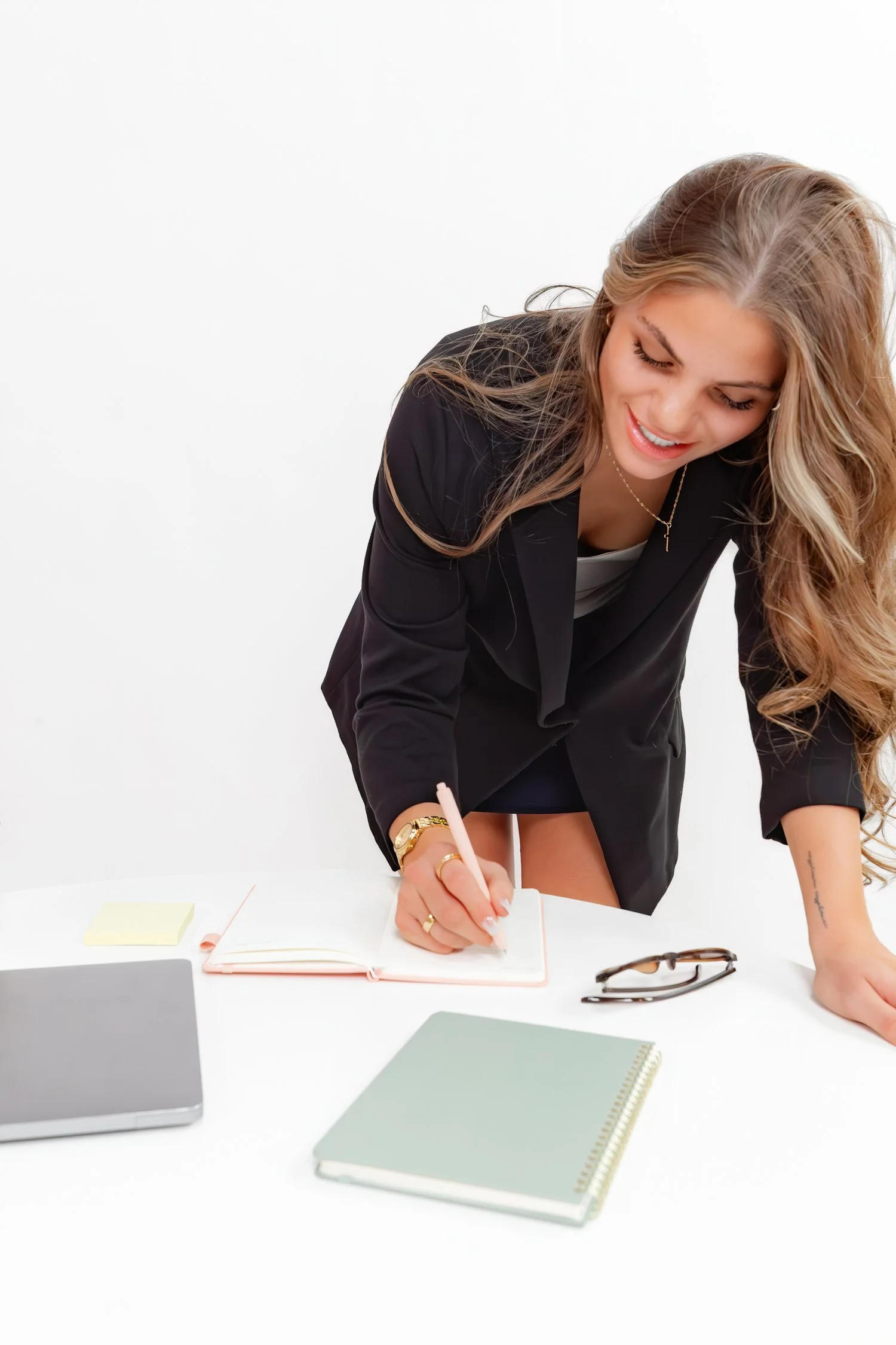 Business owner planning content at a studio table.