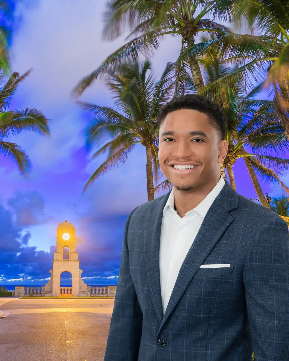 Personal branding portrait of a young businessman at twilight by palm trees and the Palm Beach clock tower