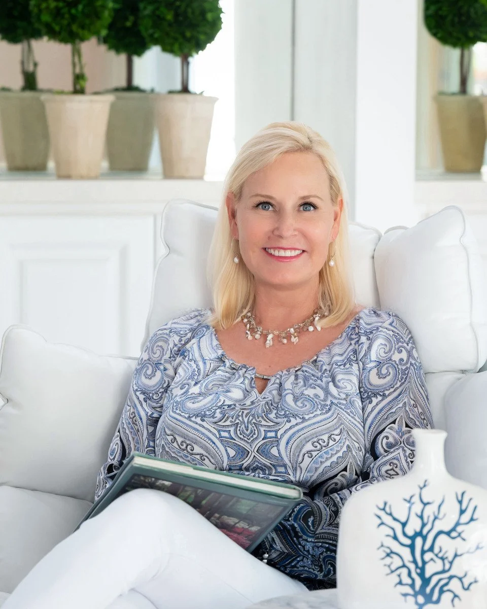 Lifestyle branding portrait of a woman seated in an elegant white coastal interior, Palm Beach personal branding