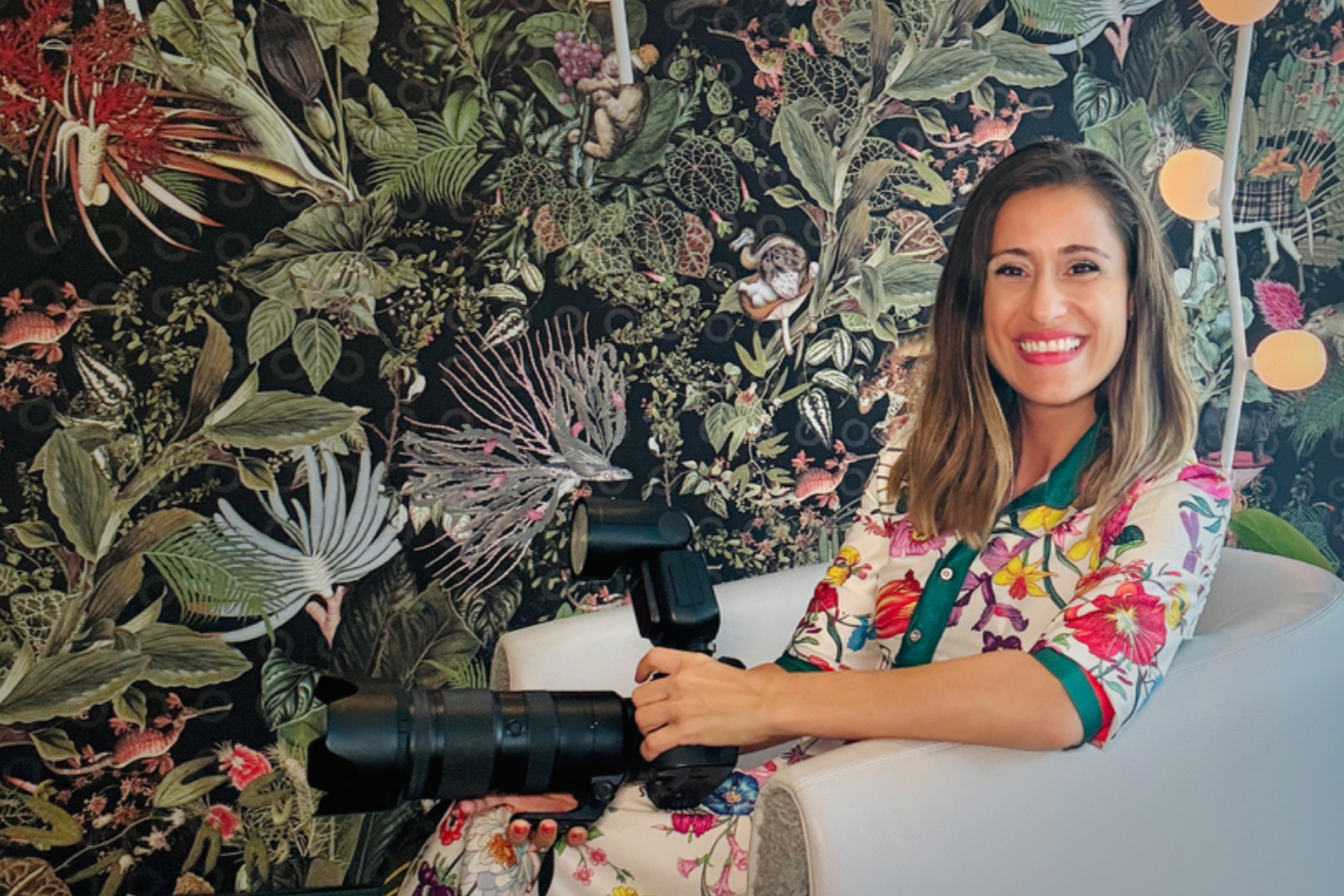 Portrait photographer Vasi Siedman of Vasi Studio with her camera, Palm Beach Gardens photographer and PPA member