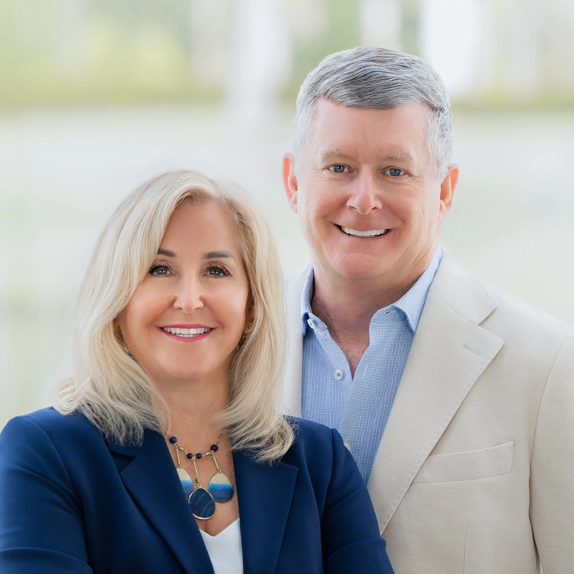 Business partners portrait of a woman and man in blazers outdoors, executive team photography South Florida