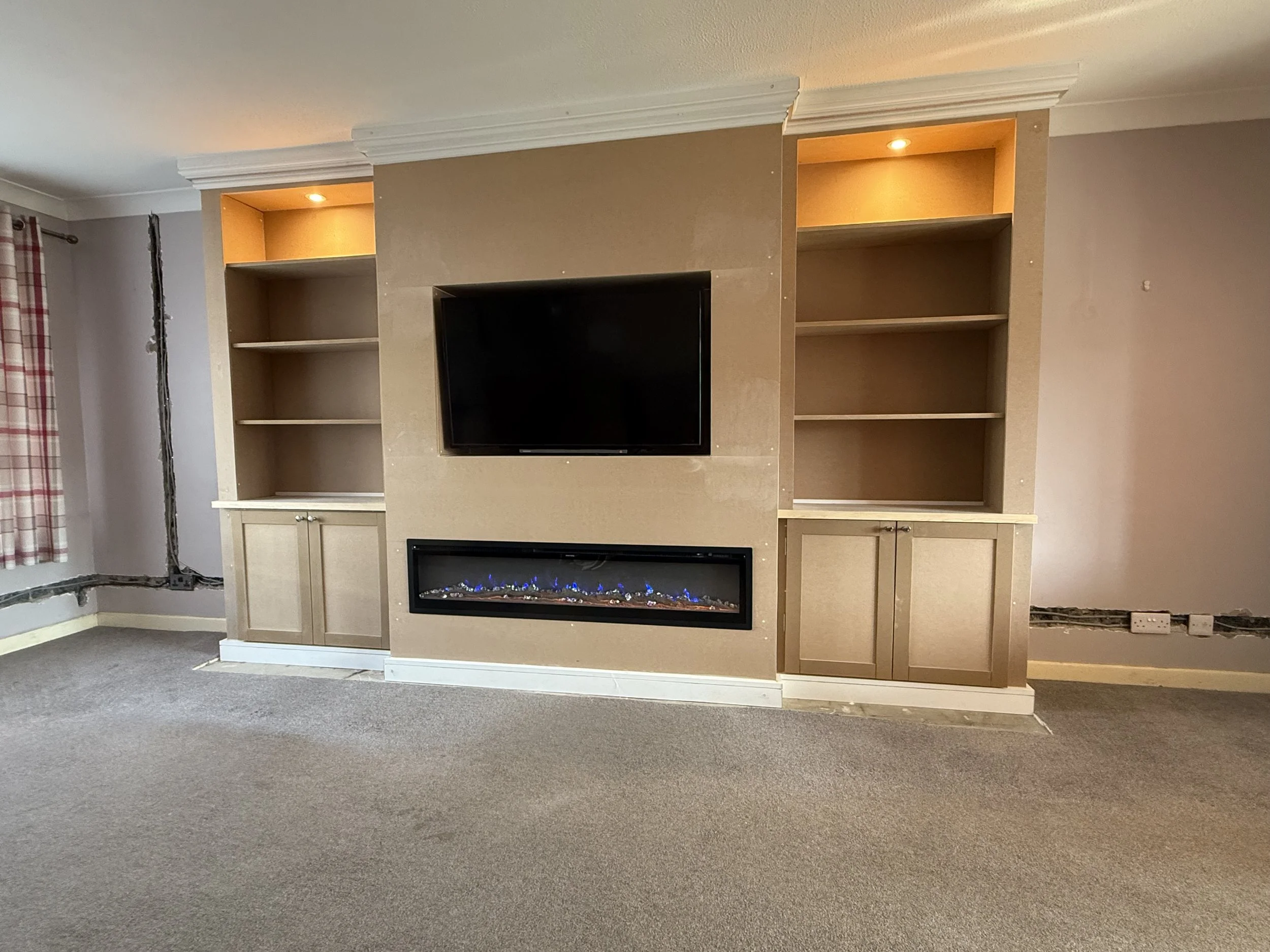 Bespoke media wall with built in fire, inset fireplace, bespoke storage solutions, MDF storage media wall