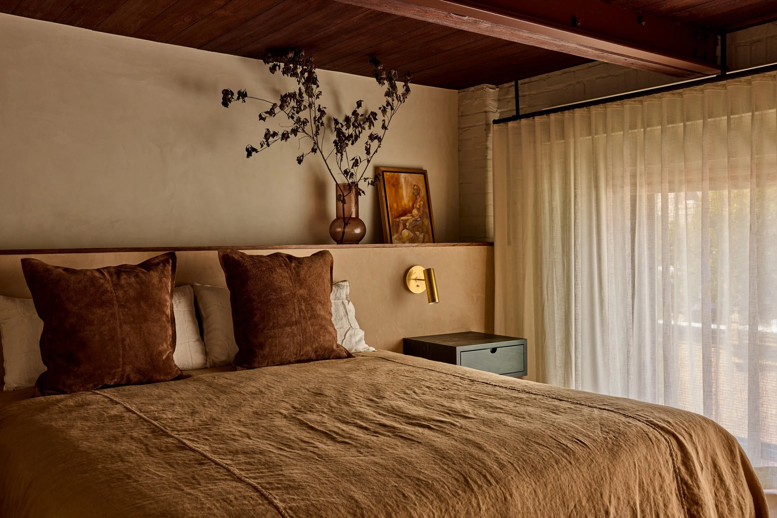 casual linen bedcover withing a luxurious primary bedroom