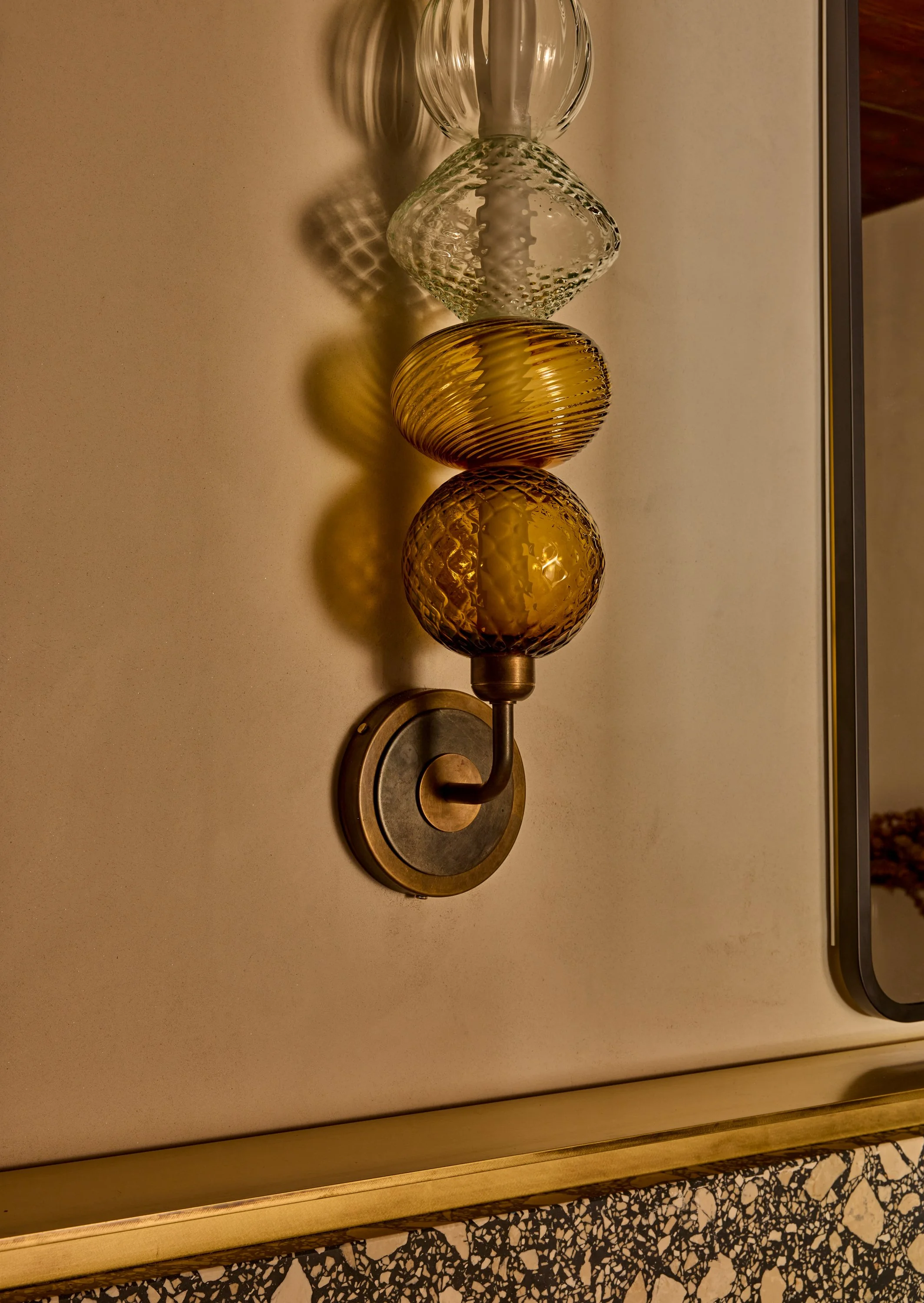 custom sconce with stacked glass shades