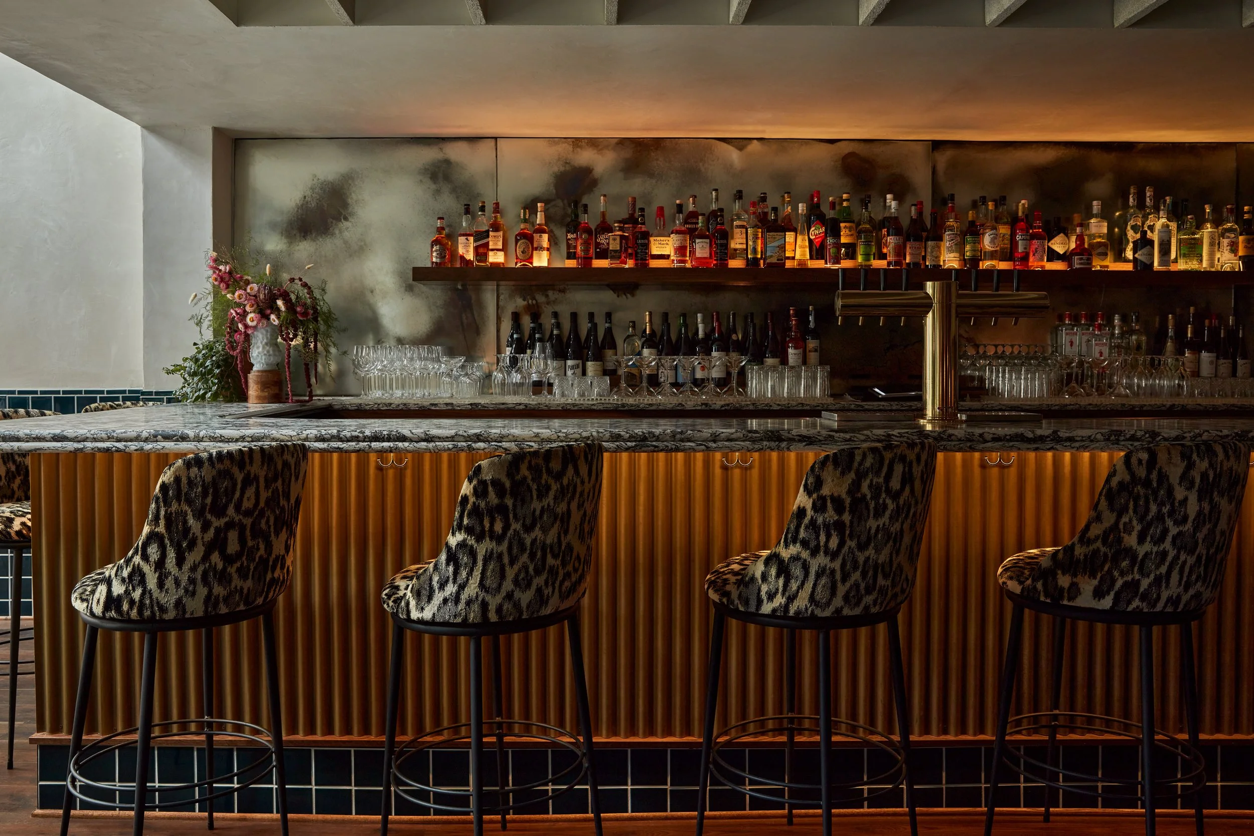 restaurant bar overview showing velocette's custom leopard bartools
