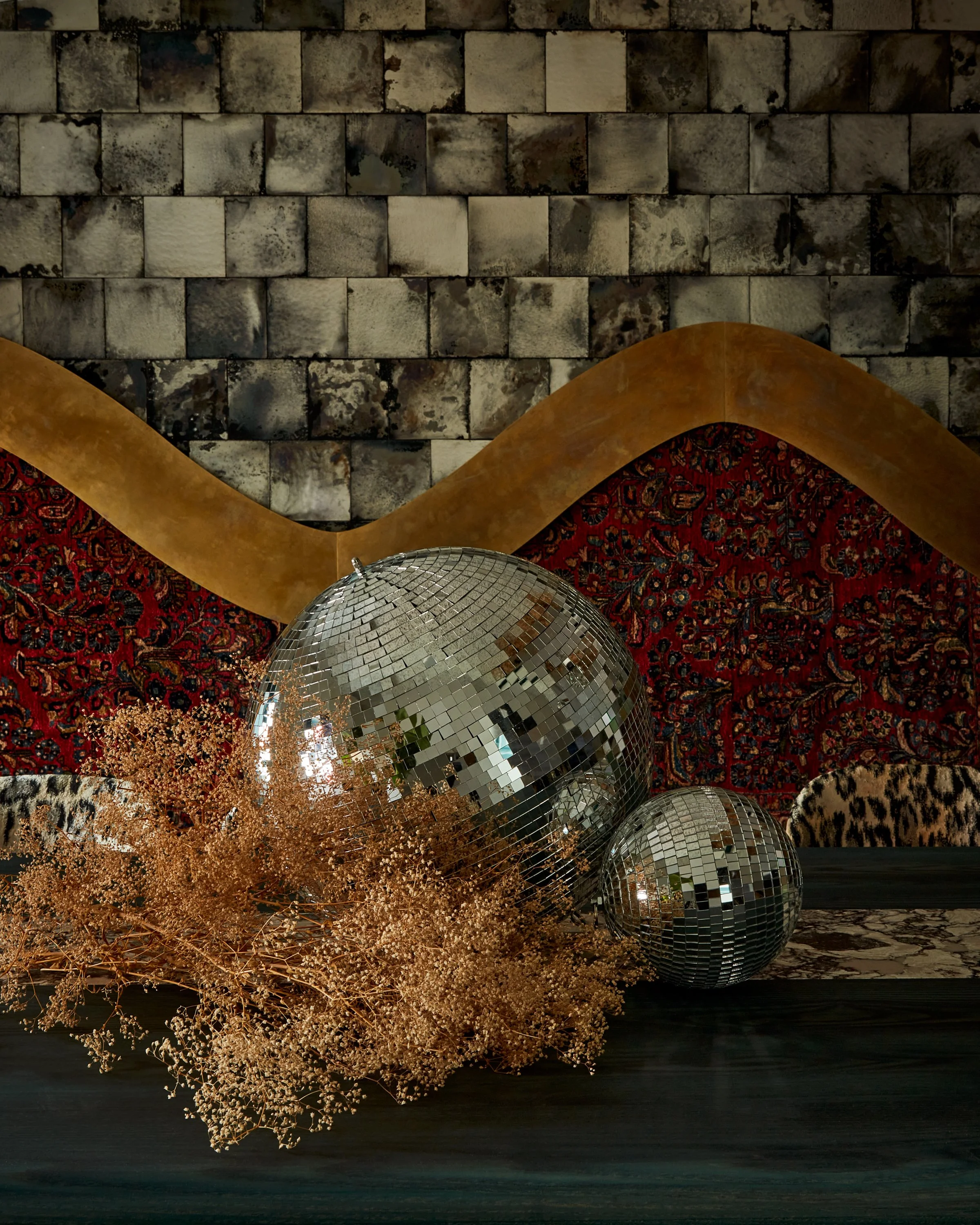 private dining table styling features dry flowers and disco balls
