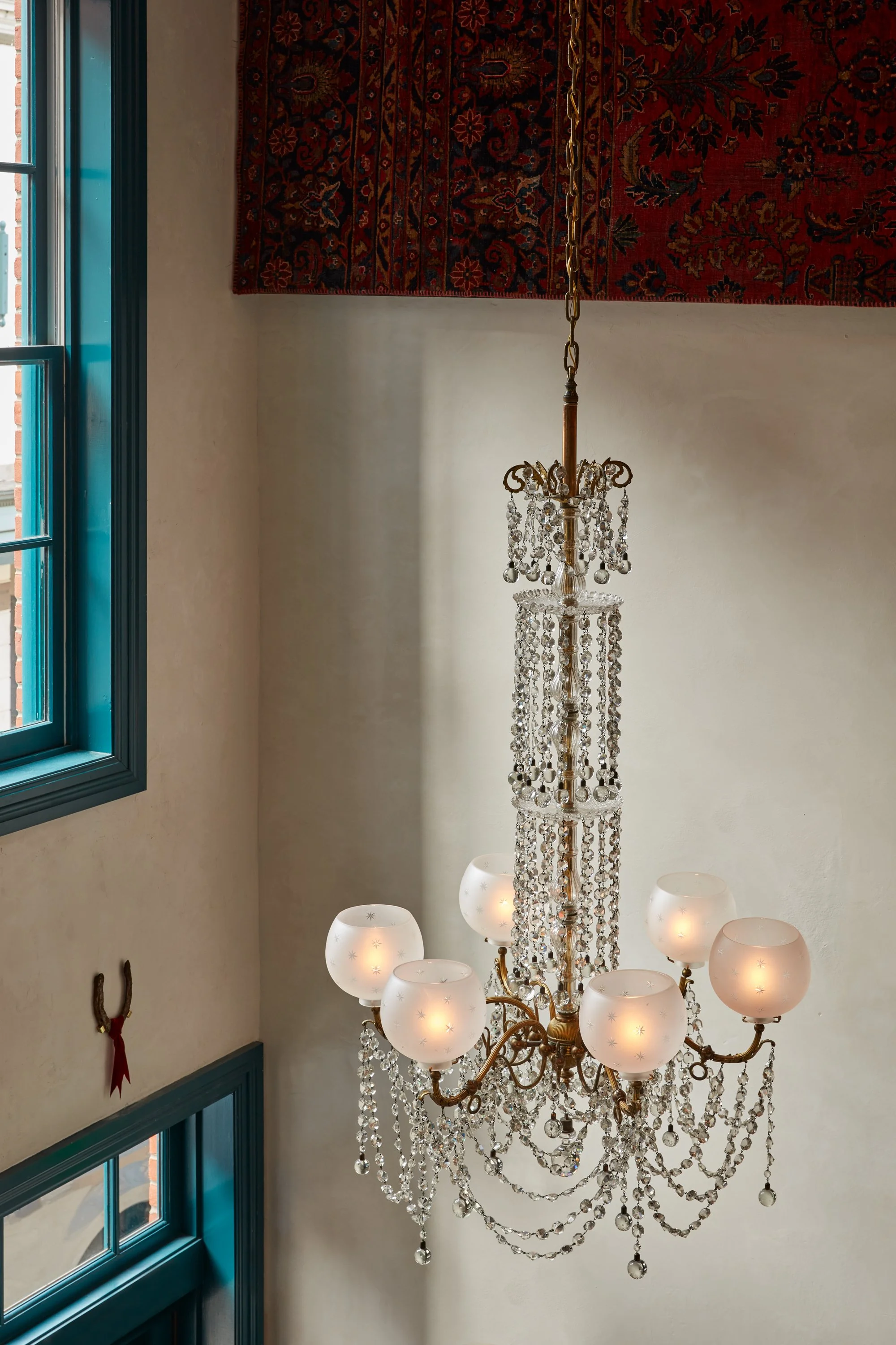 grand chandelier hanging over bar