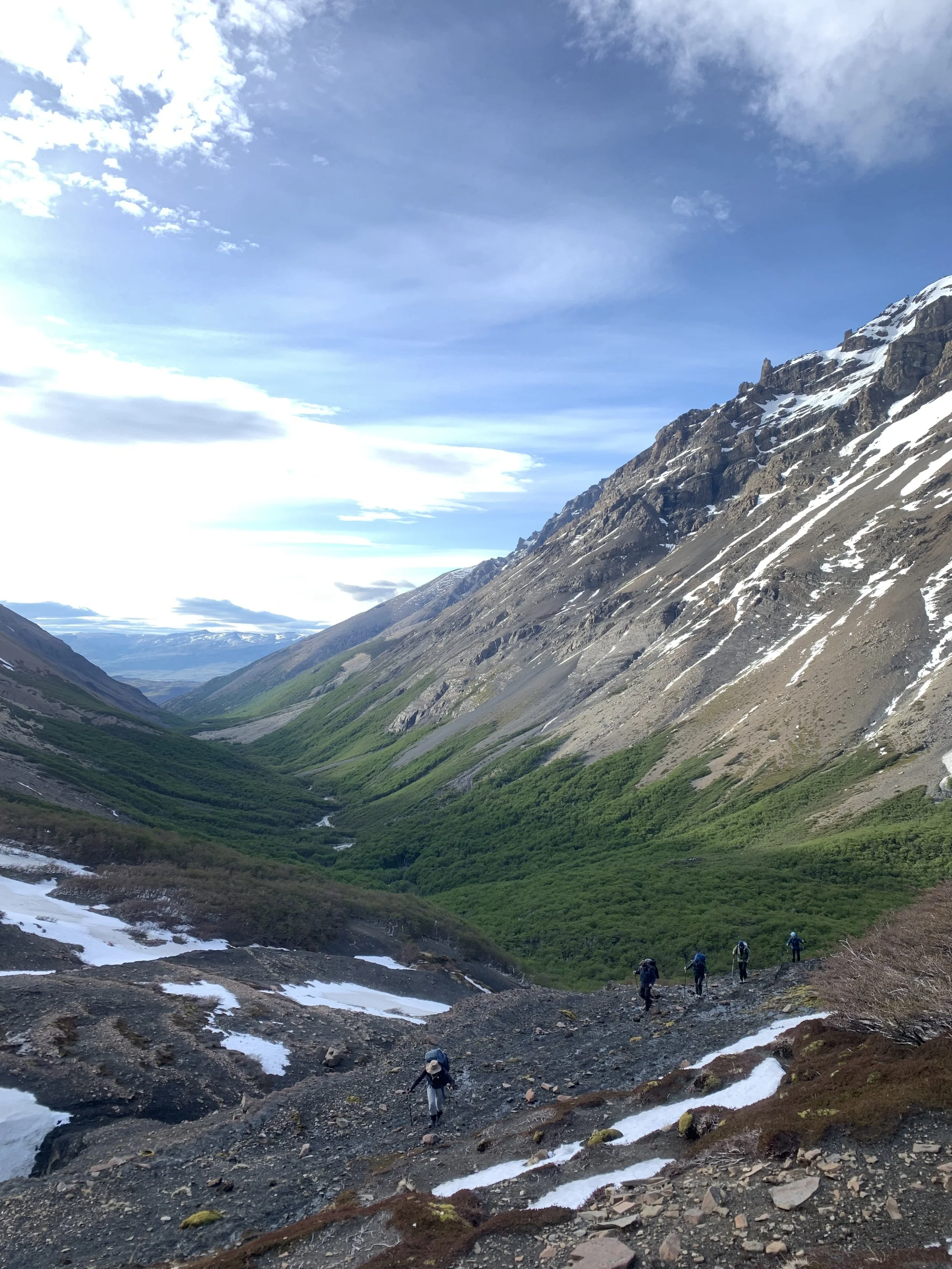 Hiker headed up Paso Oggioni, on a guided climbing trip with Paine Mountain Guides, a locally owned and operated guides company that run many different trips in Torres del Paine, in Chilean patagonia.