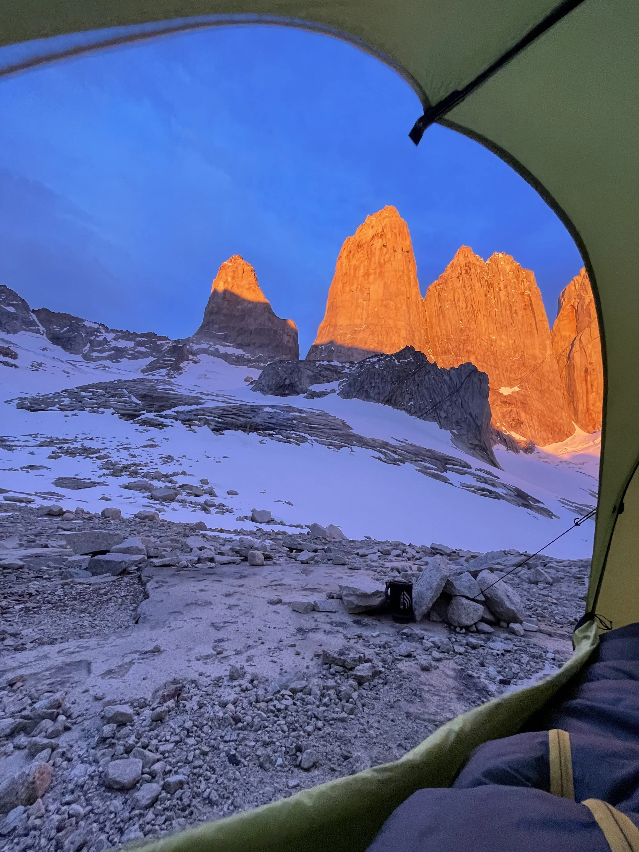 View of the Torres del Paine from inside a tent at base camp on a guided trip with Paine Mountain Guides, a local Guiding company