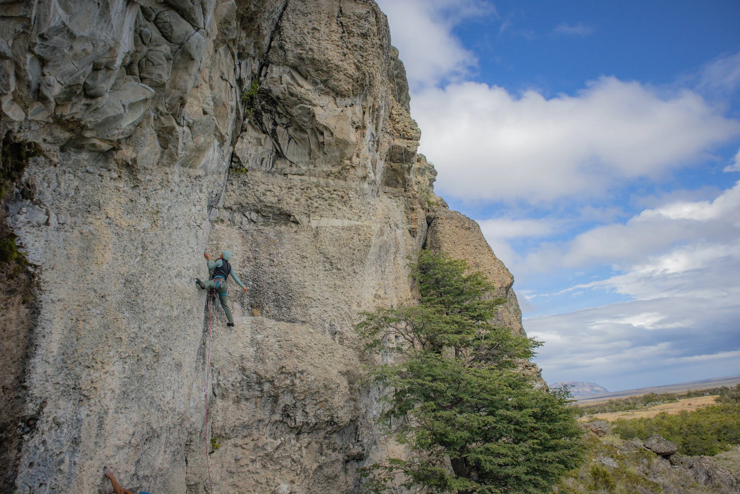 Rock climbing at Cueva del medio, on a guided climbing trip with Paine Mountain Guides, a locally owned and operated guides company that run many different trips in Torres del Paine, Chilean Patagonia.