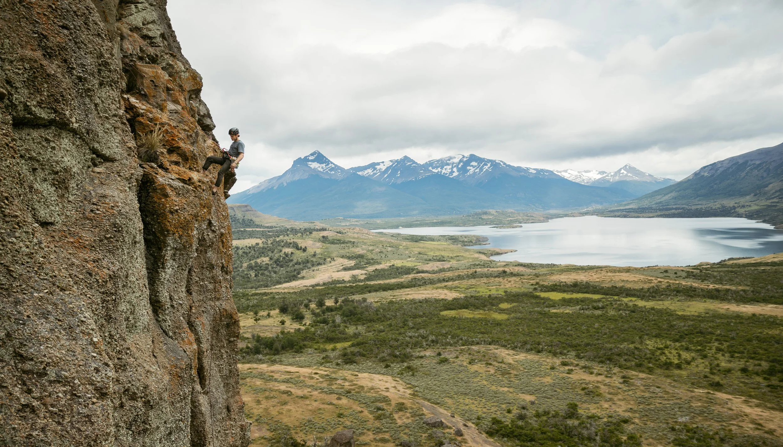 A guest rock climbing at Laguna Sofia, Puerto Natales, on a guiding climbing trip with Paine Mountain Guides, a locally owned and operated guides company that run many different trips in Torres del Paine National Park, Patagonia