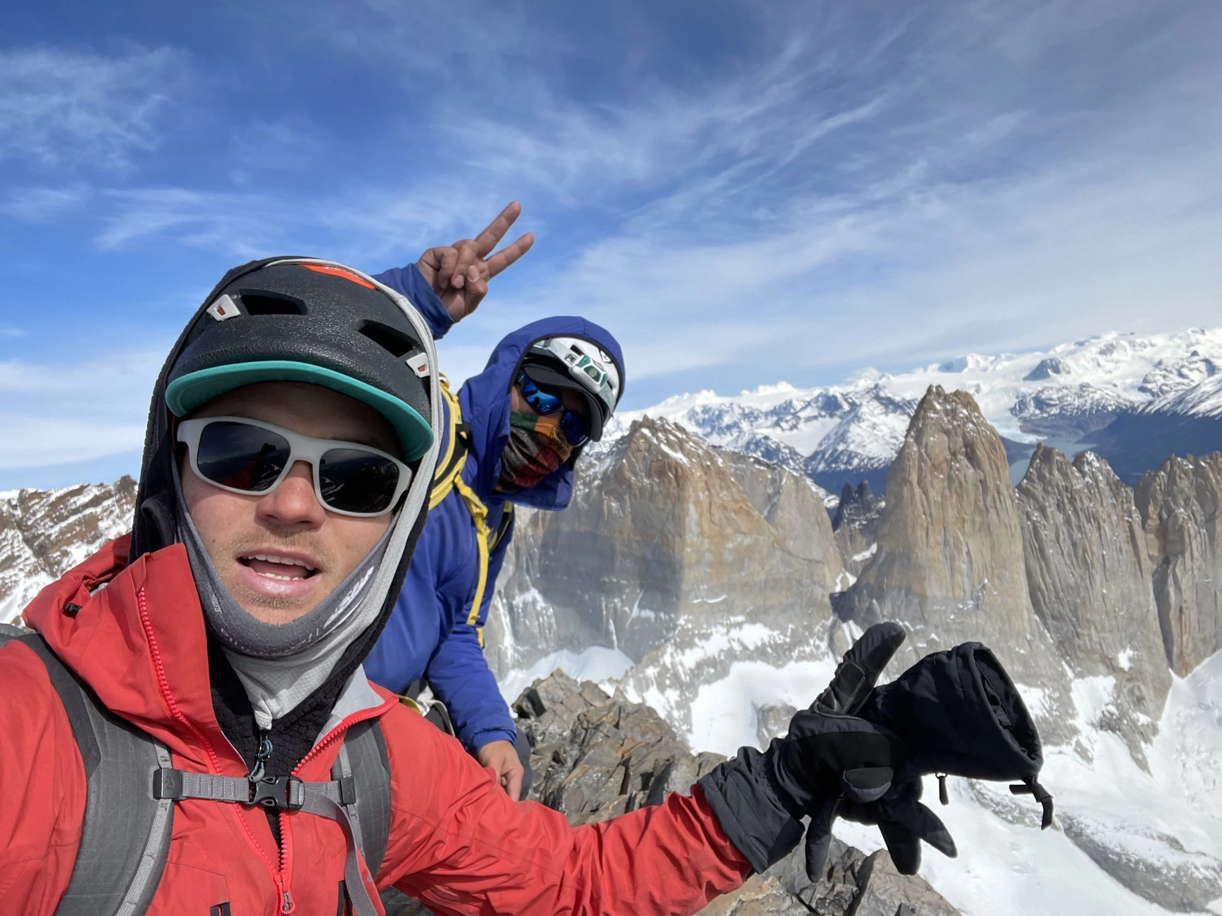 Seba Pelletti, and his guest, on the summit of Mount Almirante Nieto, on a guiding climbing trip with Paine Mountain Guides, a locally owned and operated guides company that run many different trips in Torres del Paine National Park, Patagonia