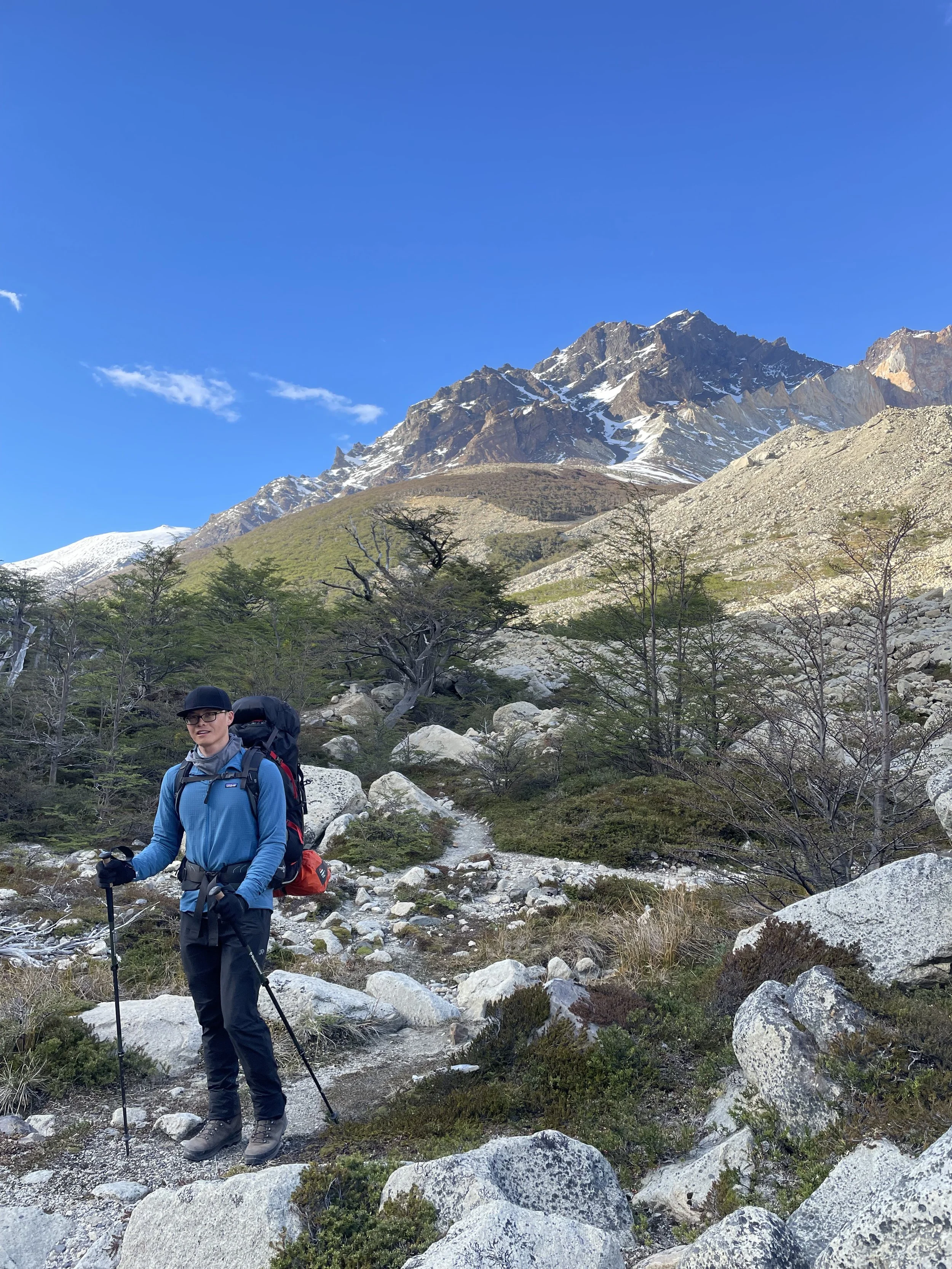 A hiker headed up the trail in Valle del Silencio, on a guided climbing trip with Paine Mountain Guides, a locally owned and operated guides company that run many different trips in Torres del Paine, in Chilean patagonia.