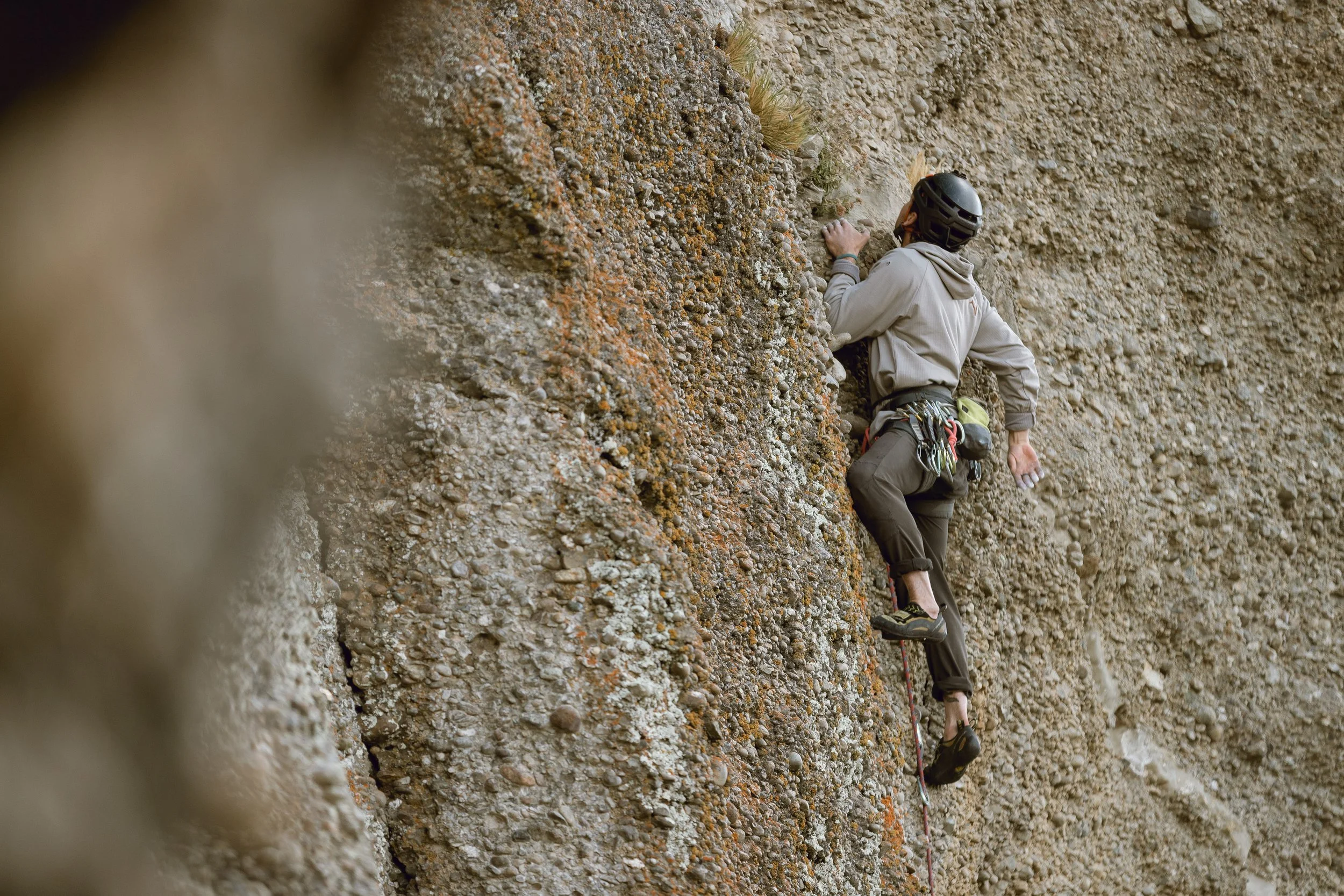 A guest rock climbing at Laguna Sofia, Puerto Natales, on a guiding climbing trip with Paine Mountain Guides, a locally owned and operated guides company that run many different trips in Torres del Paine National Park, Patagonia