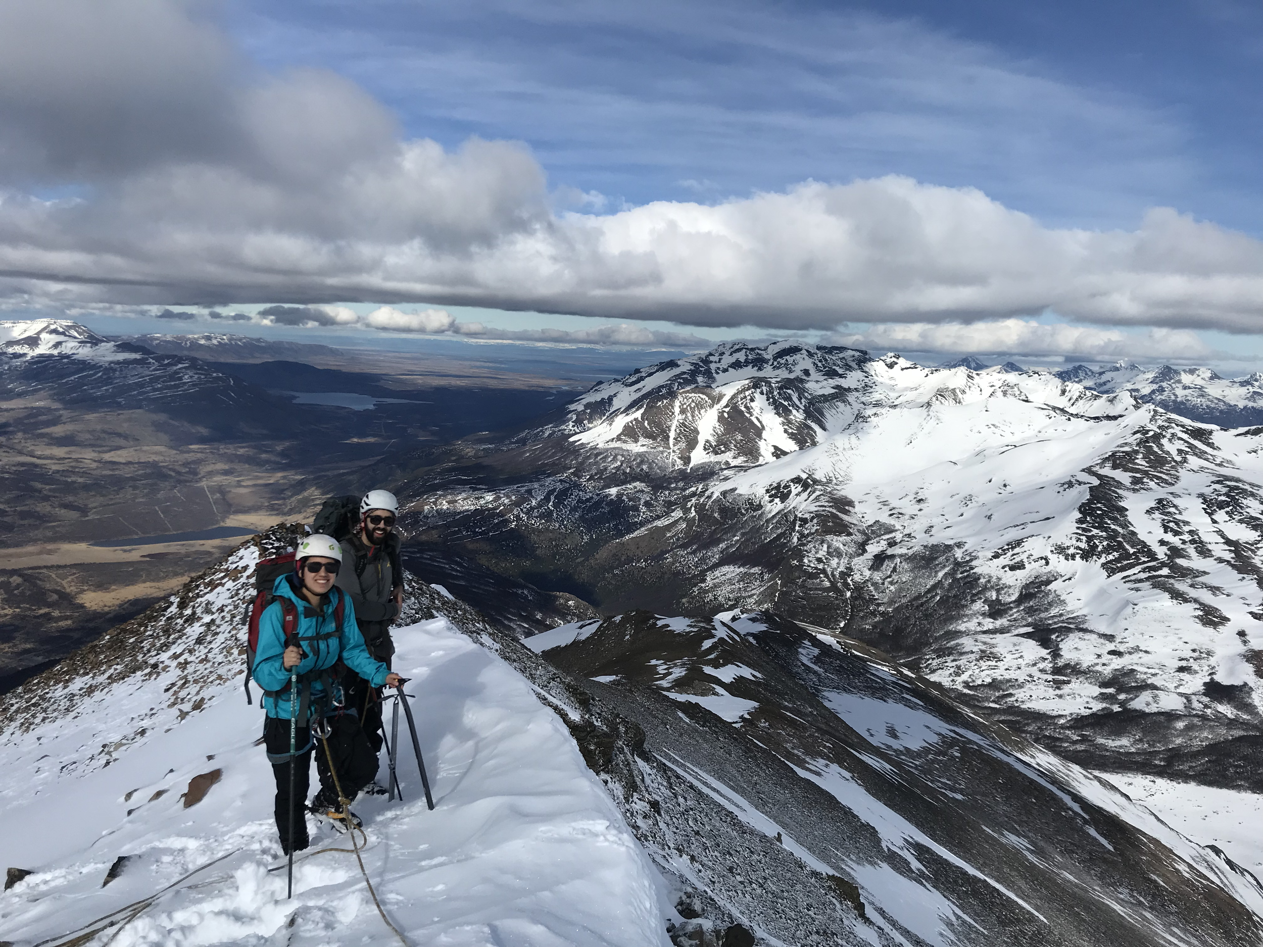Two guests, on the summit of Mount Tenerife, on a guiding climbing trip with Paine Mountain Guides, a locally owned and operated guides company that run many different trips in Torres del Paine National Park, Patagonia
