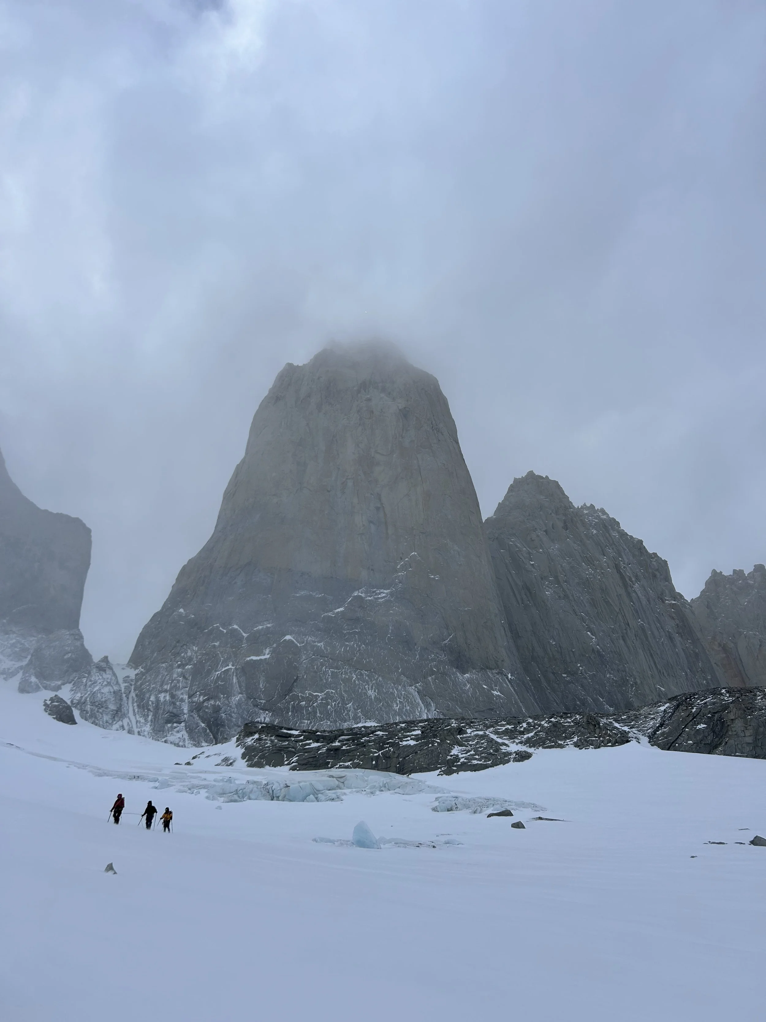 Four climbers on the Torres Glacie, below the Torres del Paine, on a guided climbing trip with Paine Mountain Guides, a locally owned and operated guides company that run many different trips in Torres del Paine, in Chilean patagonia.