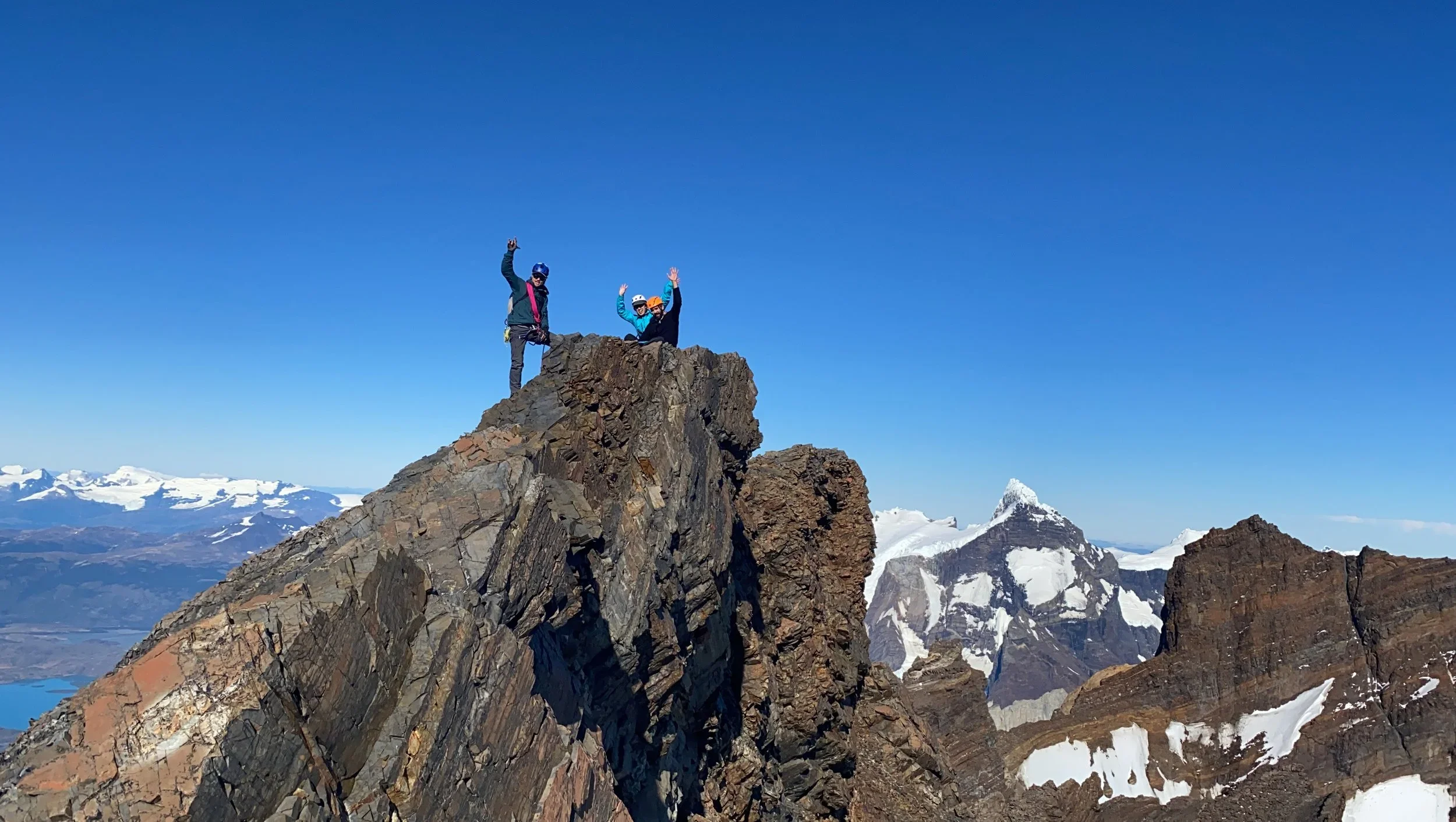 Mountain guide and guest on the summit of Mount Almirante Nieto, on a guiding climbing trip with Paine Mountain Guides, a locally owned and operated guides company that run many different trips in Torres del Paine National Park, Patagonia