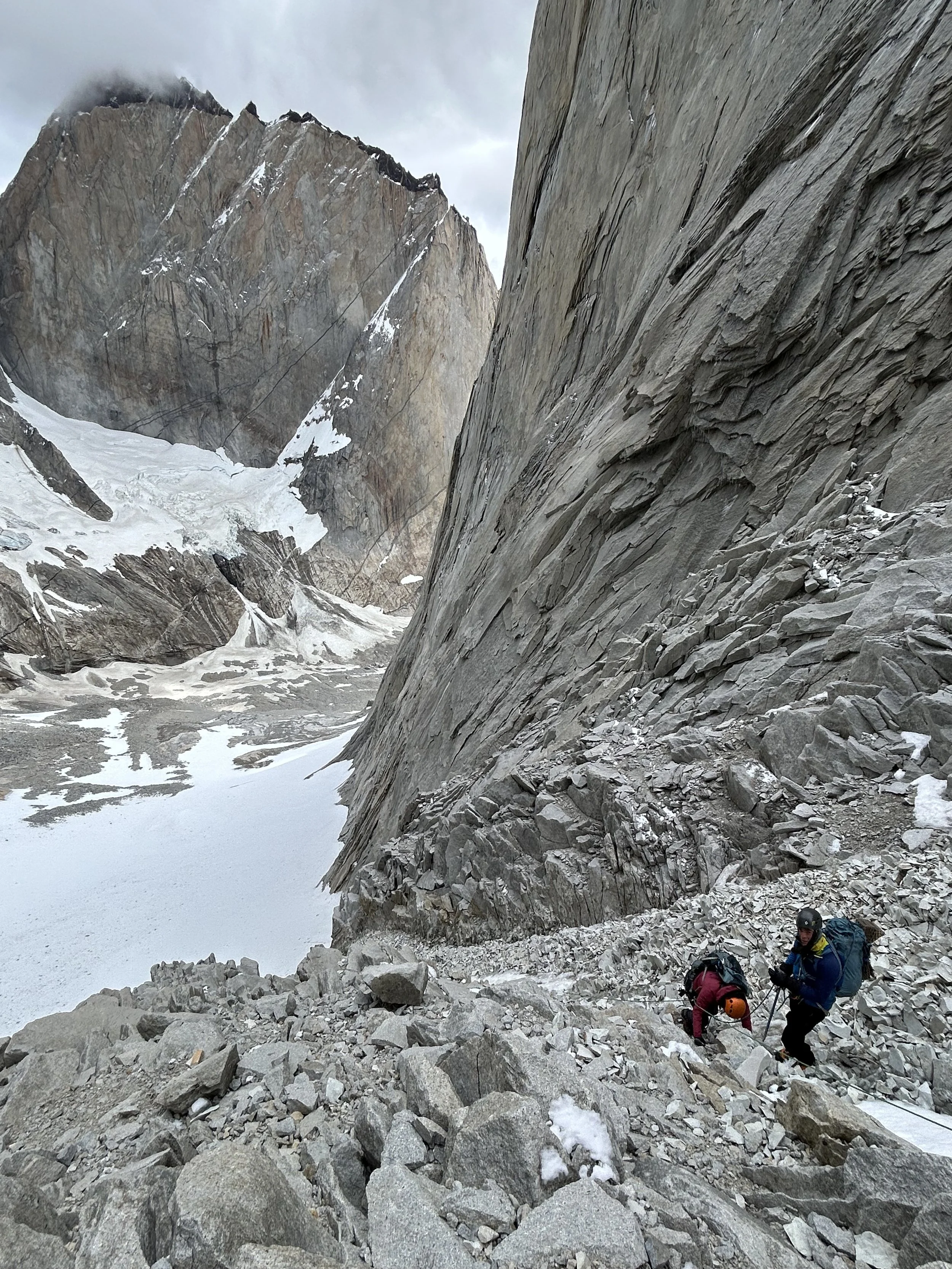 Two climbers headed up the Condoir Couloir, on the Torres Traverse, on a guided climbing trip with Paine Mountain Guides, a locally owned and operated guides company that run many different trips in Torres del Paine, in Chilean patagonia.