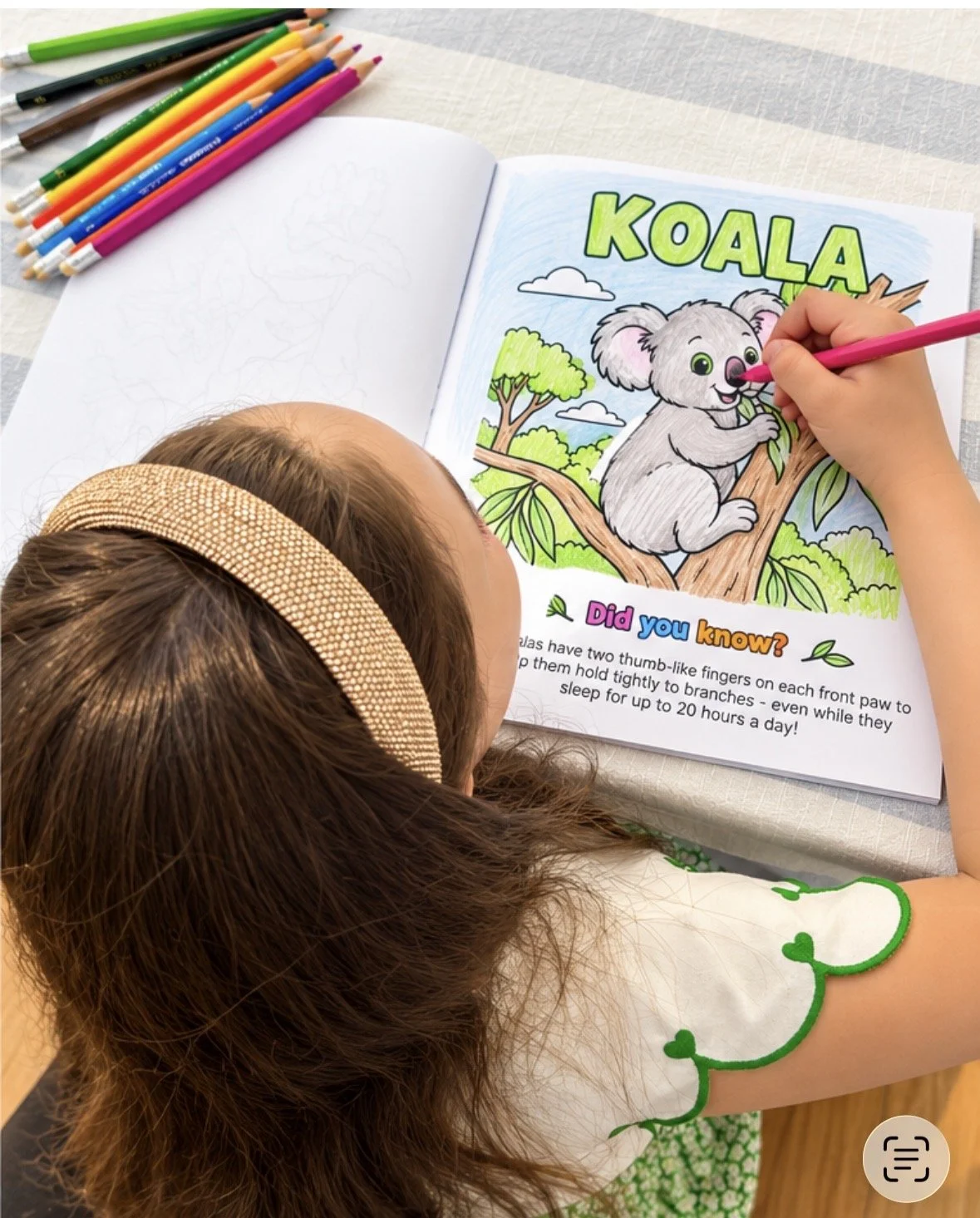 A child colouring the koala page in Little Aussie Adventures
