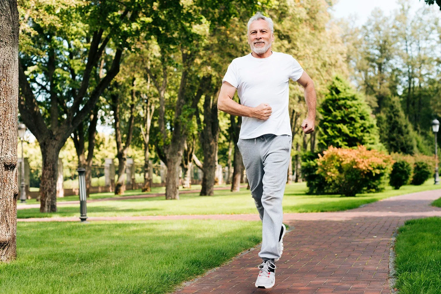 Man running in a park during cardiac recovery