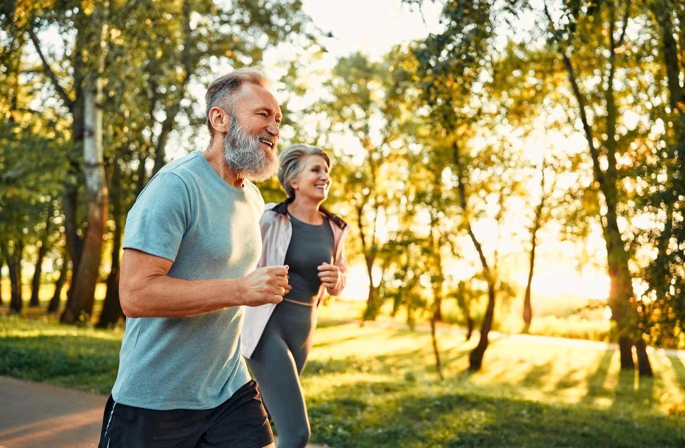 Active couple jogging together outdoors
