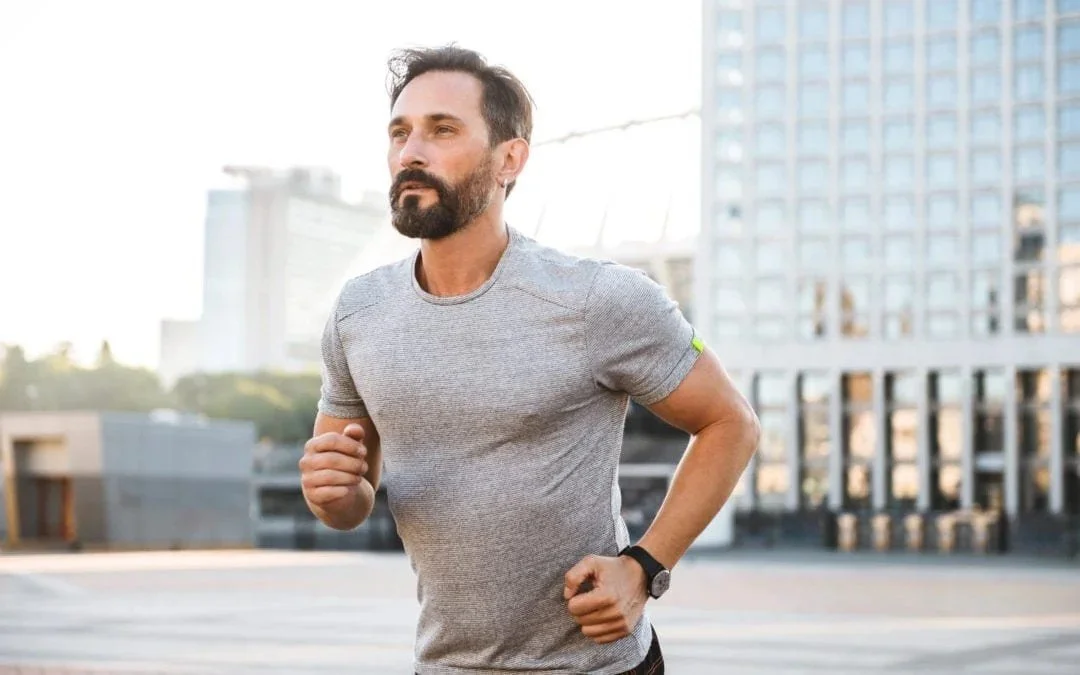 Man jogging in the city after returning to activity