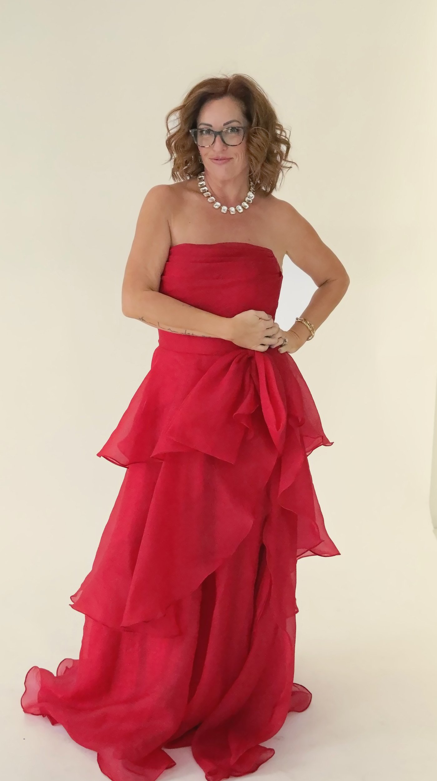 Wende Valentine in a red gown, smiling