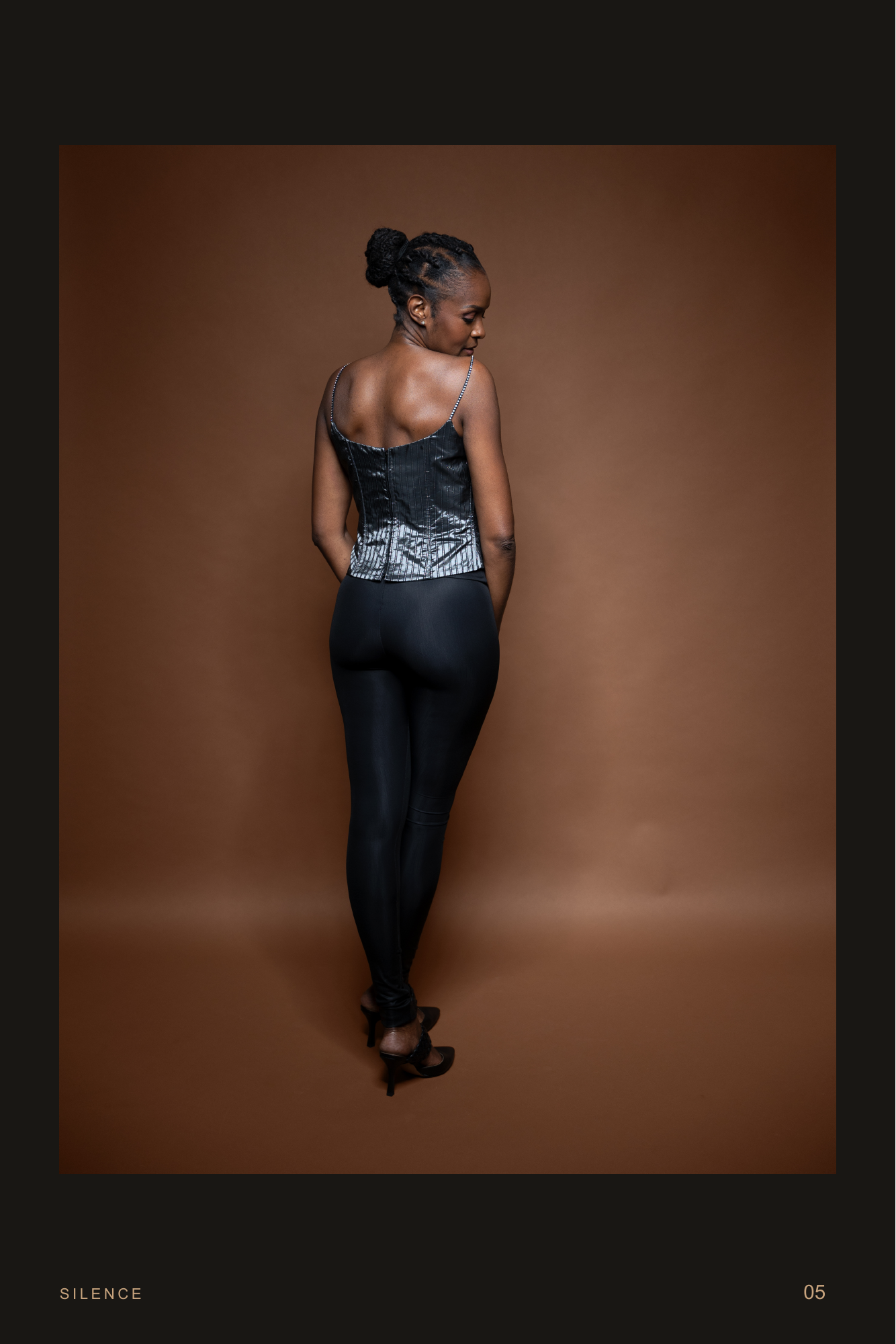 Strength In Grace, page 5. She looks back over her shoulder as the silver fabric catches the light.