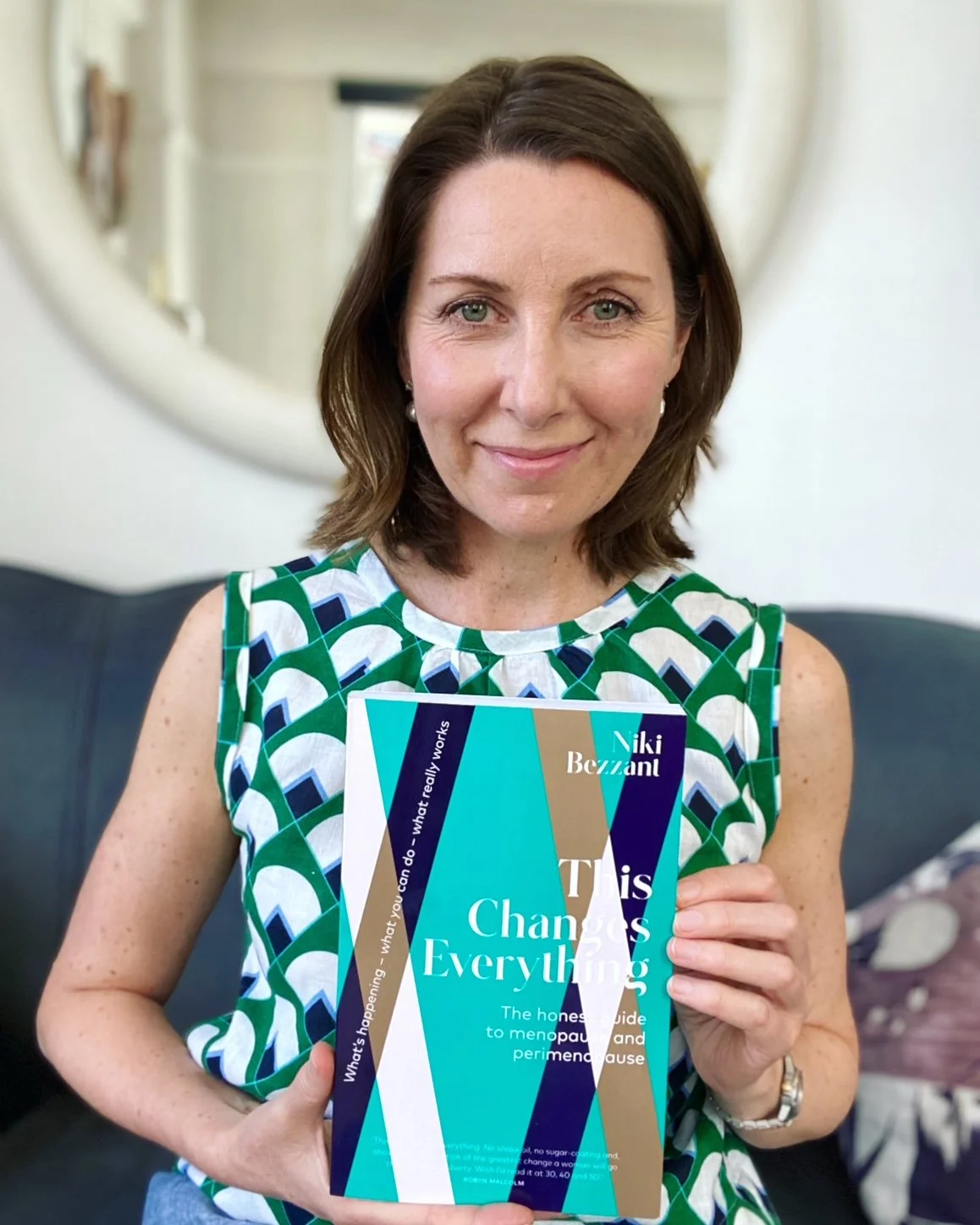 Niki Bezzant menopause expert holding her book This Changes Everything
