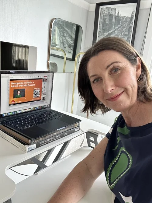 Niki Bezzant writing on her laptop at home