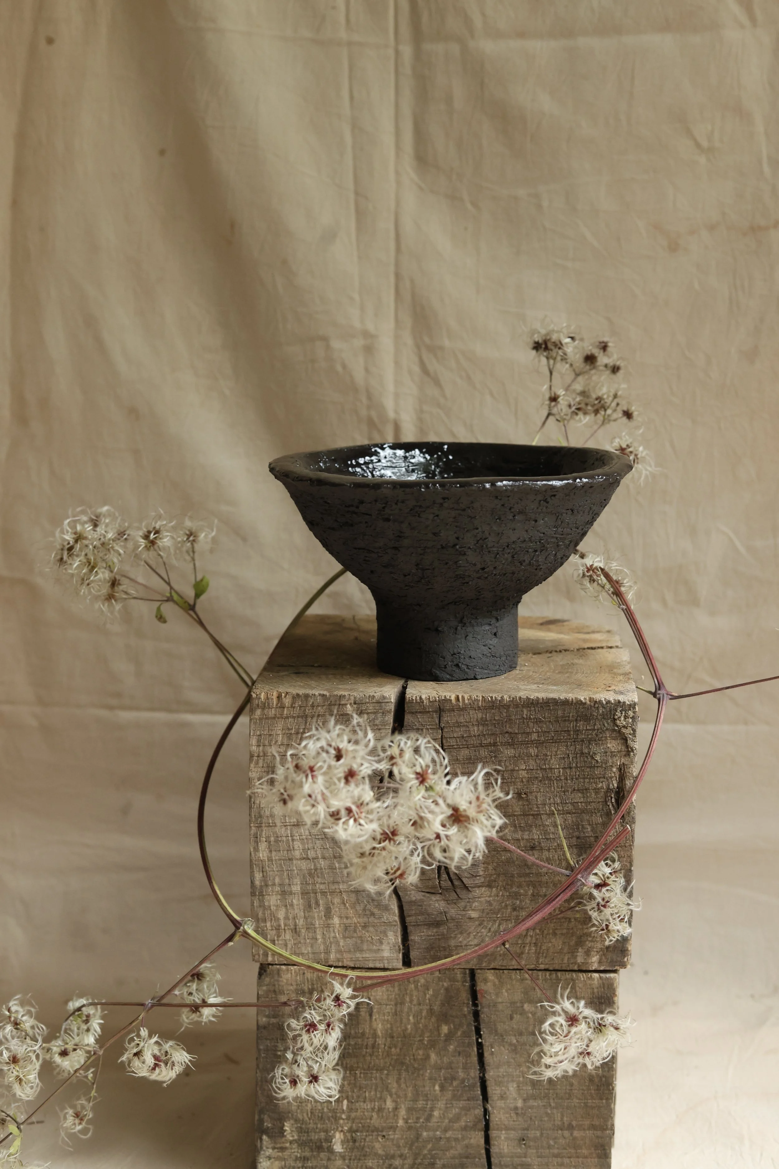 Footed black bowl