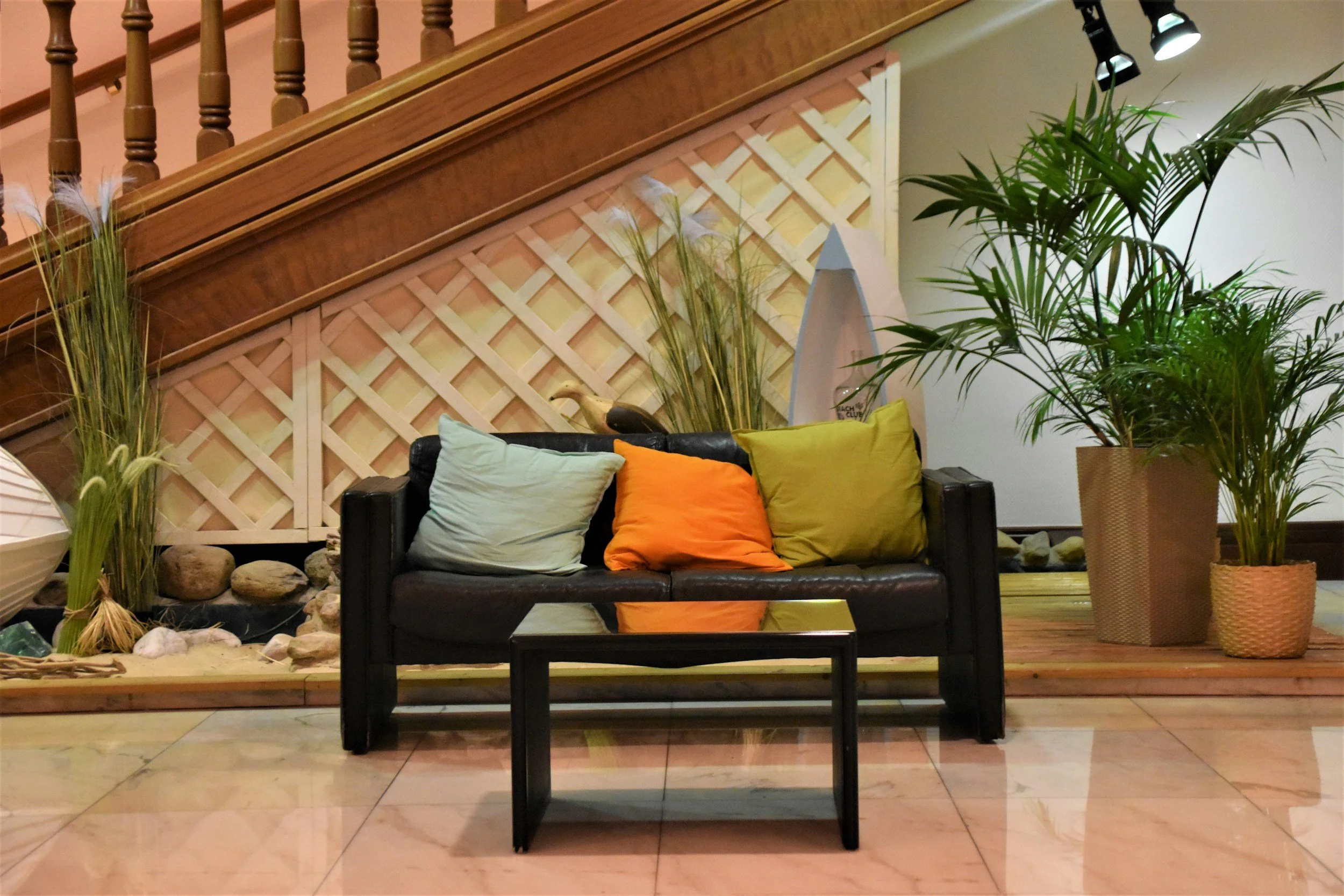 Hotel lounge furnished with sofas, armchairs and coffee tables