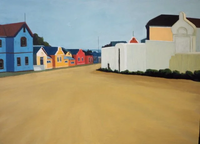 Painting of a quiet street with colorful houses and a white wall on the right, under a light blue sky.