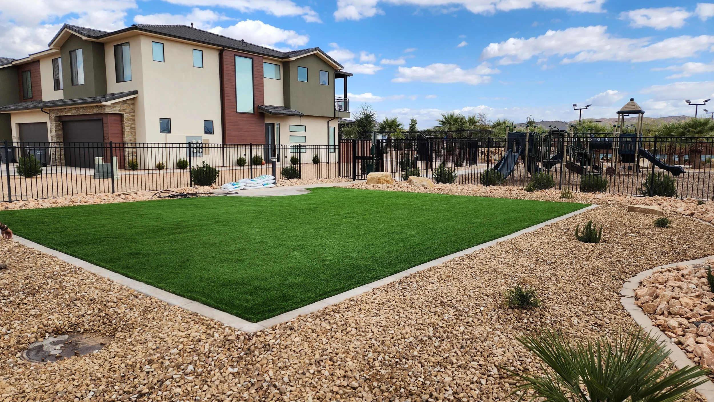 Artificial turf and landscape rock installation in a Southern Utah residential yard