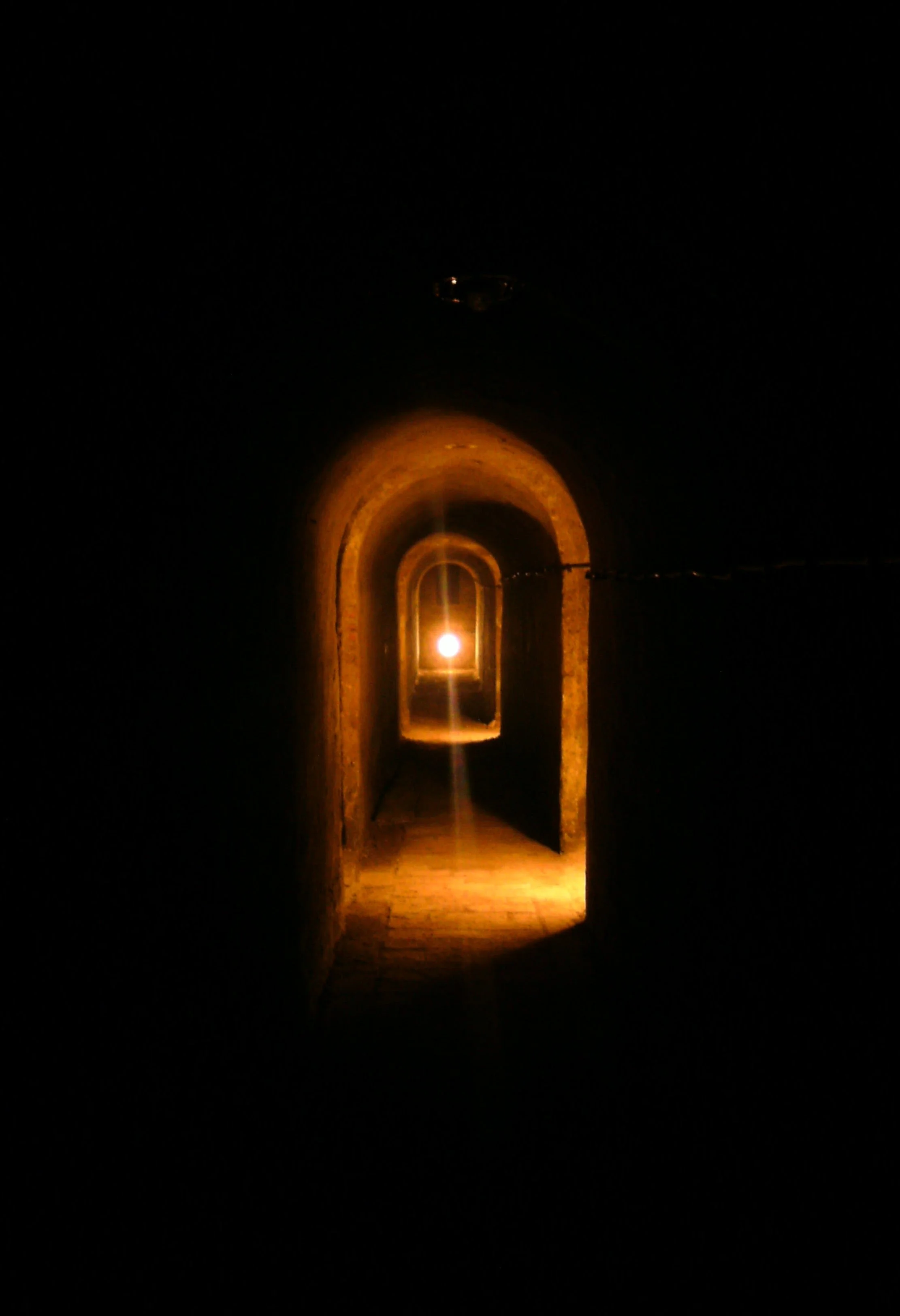 The Light of Hope (2012). The eyes that looked down this portal had only glimmers of hope. Taken in Terezín, CZ. Currently on display at the Austin Public Library - Carver Branch.