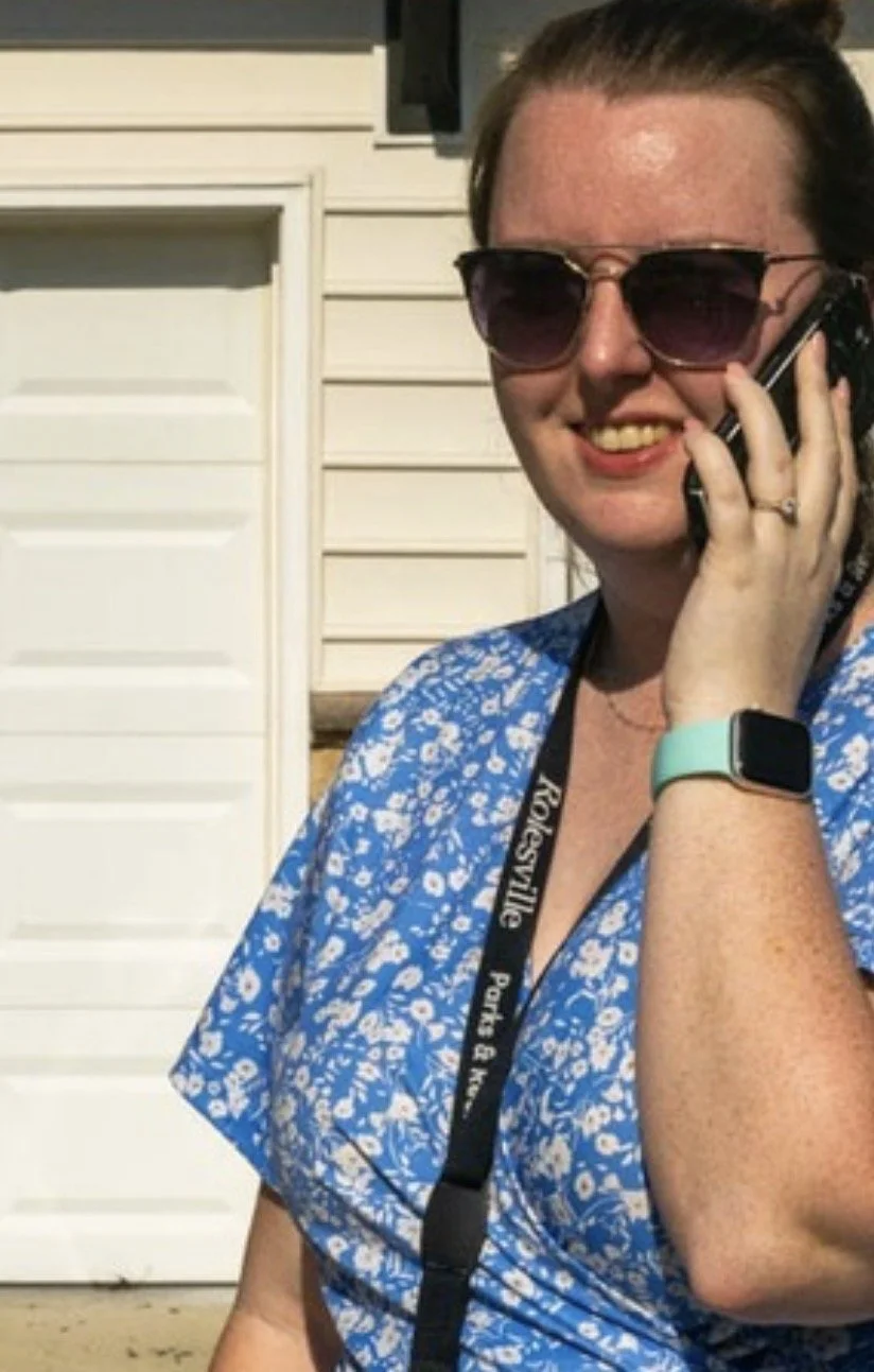 Image of me in a blue dress with white flowers talking on the phone
