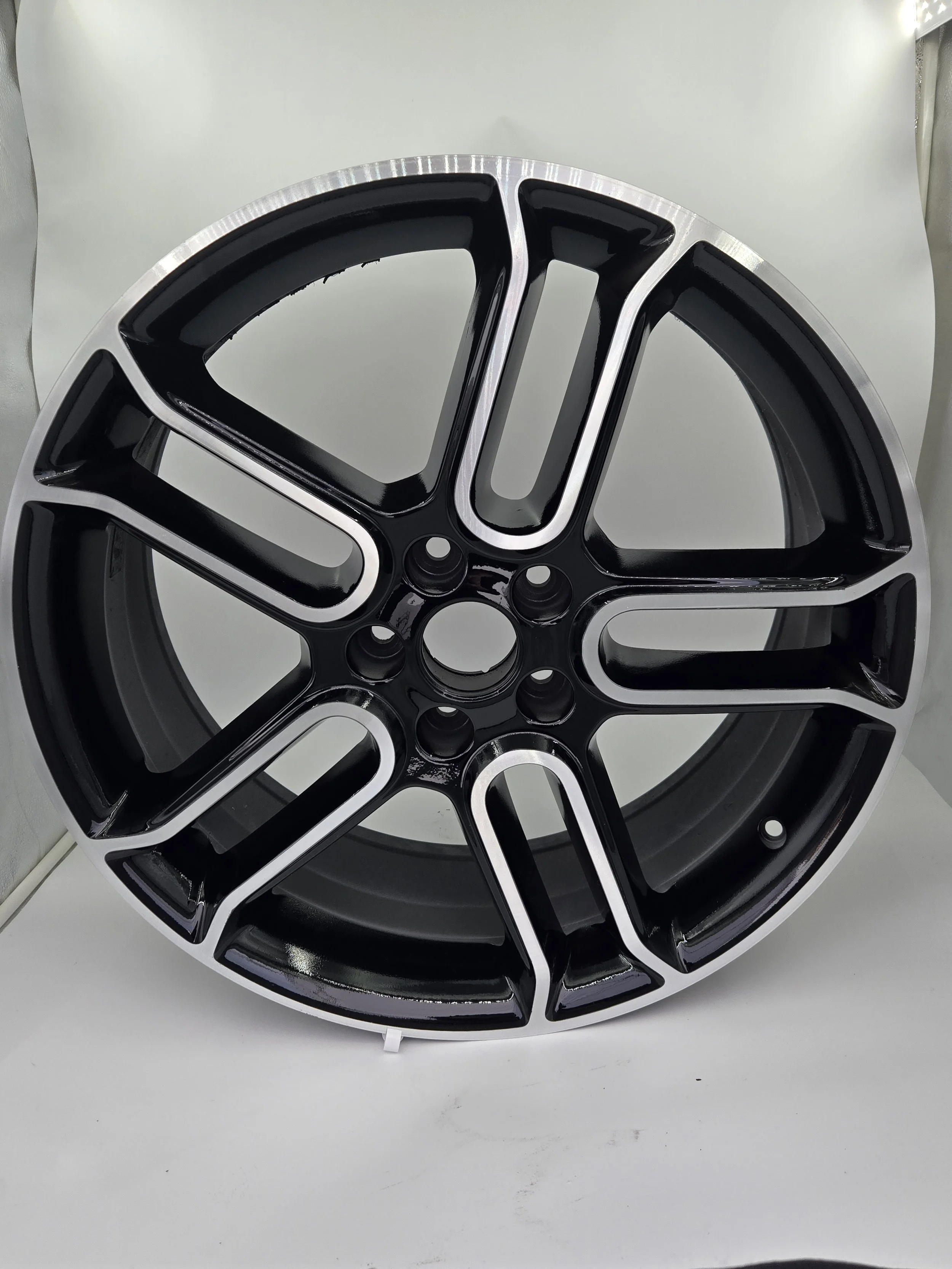 Close-up view of a black and silver car wheel rim.