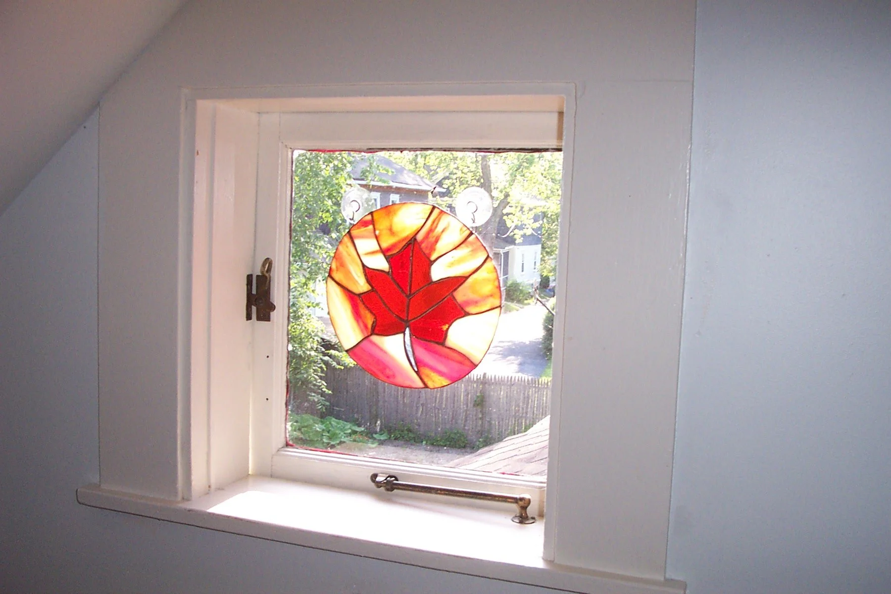 Maple stained glass in window.JPG